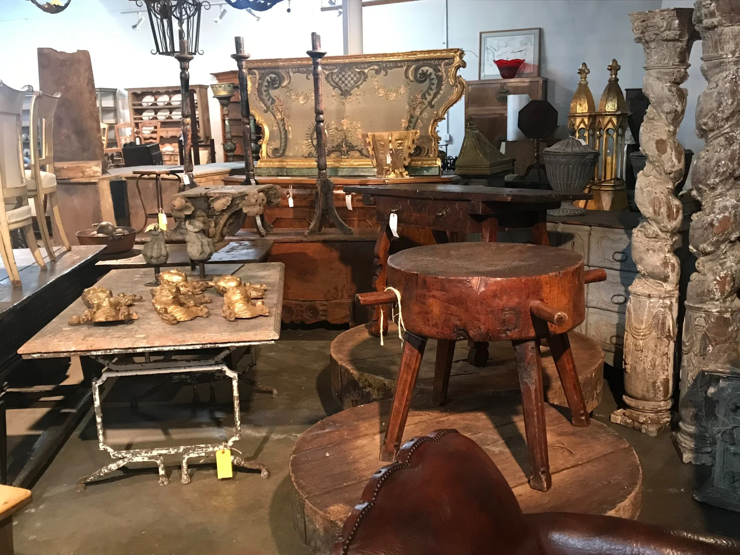 17th century Portuguese Solomonic columns, 18th century wine presses from Provence now as coffee tables, an 18th century Italian stump work embroidery altar facade, a 19th century marble top garden table from Provence and more. Photos courtesy of Provenance Antiques.