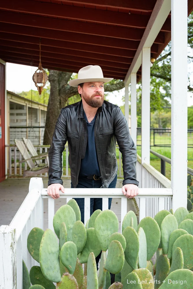 Phillip feels right at home on a private ranch in Texas as he prepares fro a day of shopping in Round Top. Photo by Ashlee Nobel, Lee Lee Arts + Design