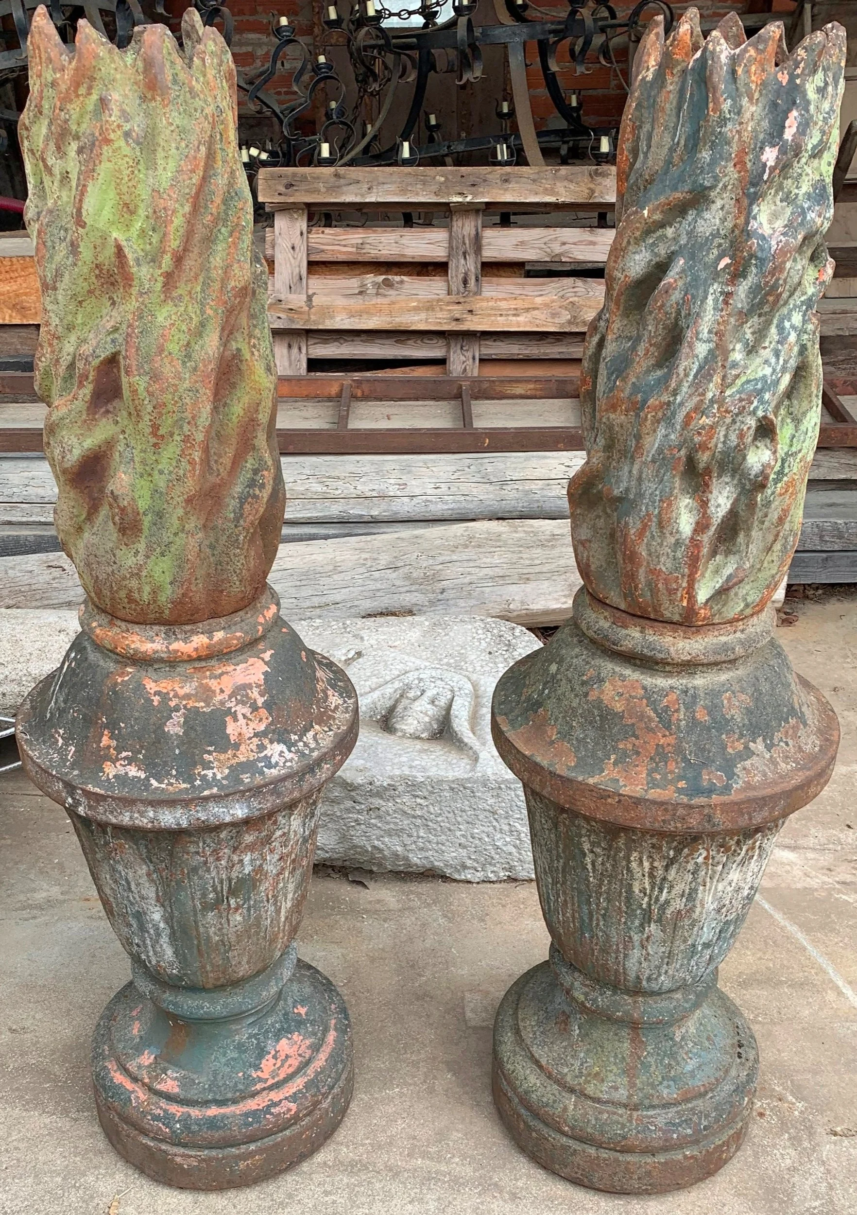 A rare pair of mid-19th-century French flambeaux finials crafted from cast iron
