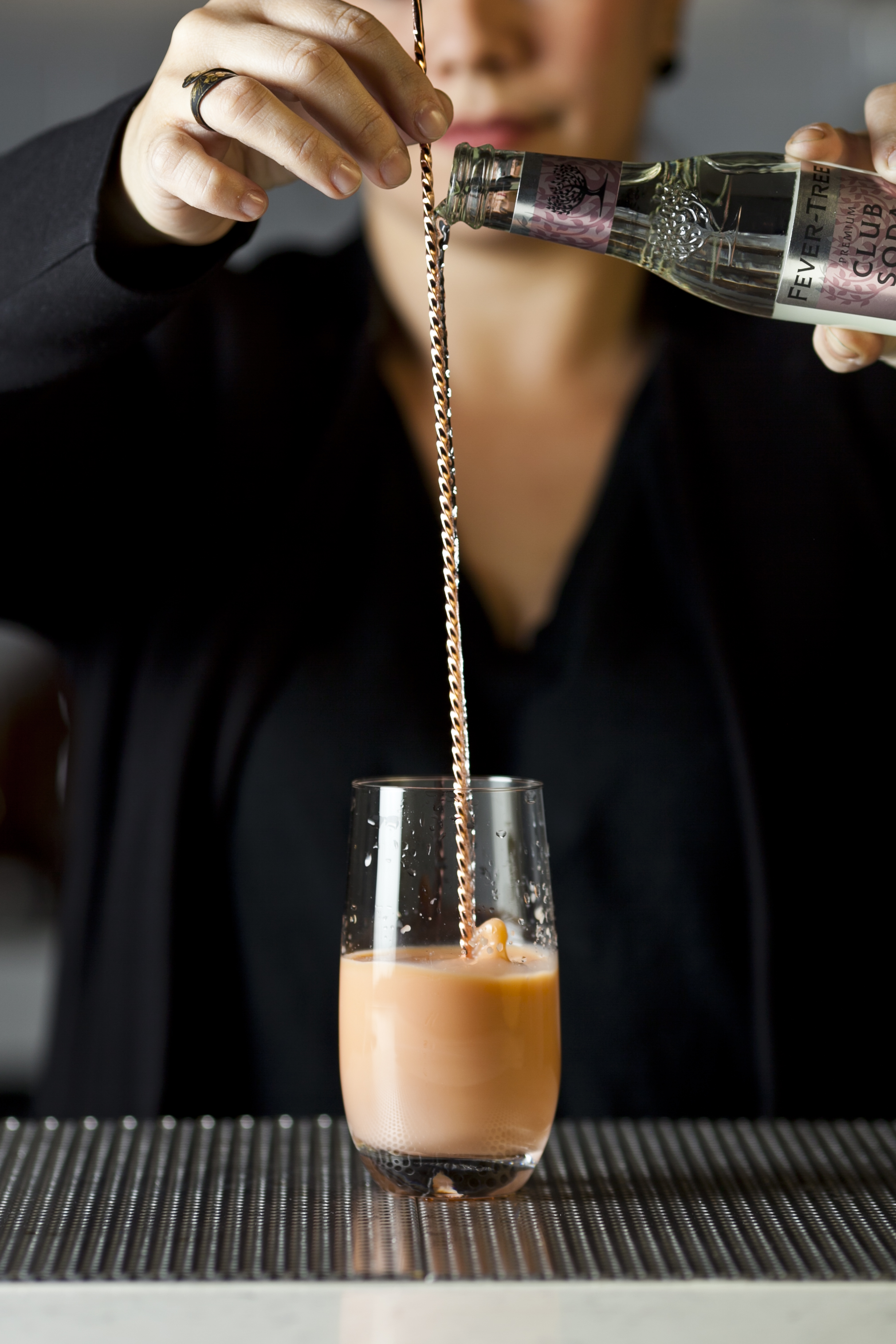 While stirring, top off with sparkling water or Club Soda.