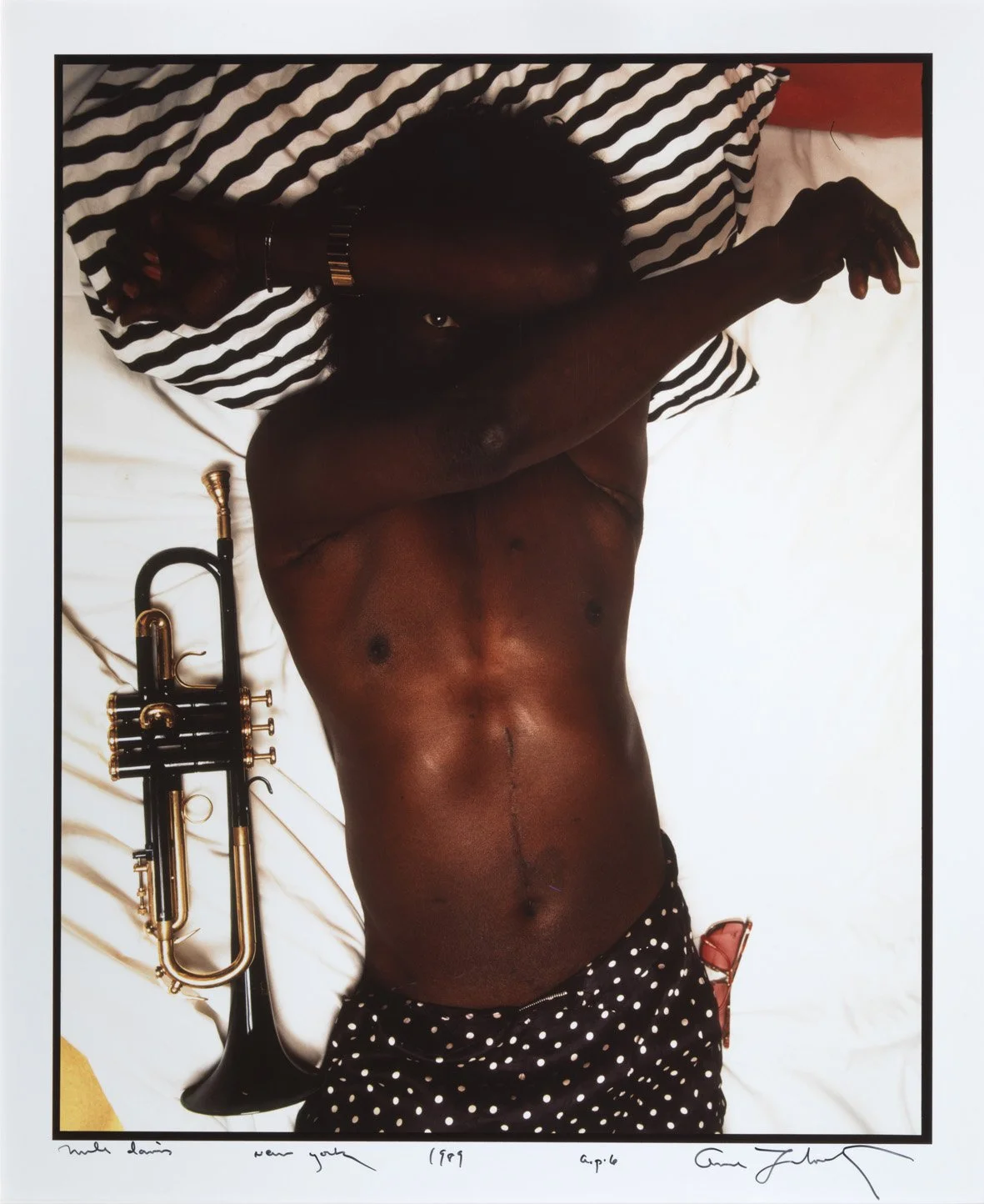   MILES DAVIS IN HIS BED, NEW YORK, 1989  Cibachrome (Dye destruction). 1989. Signed, dated, titled, and inscribed. 369 x 298 mm 