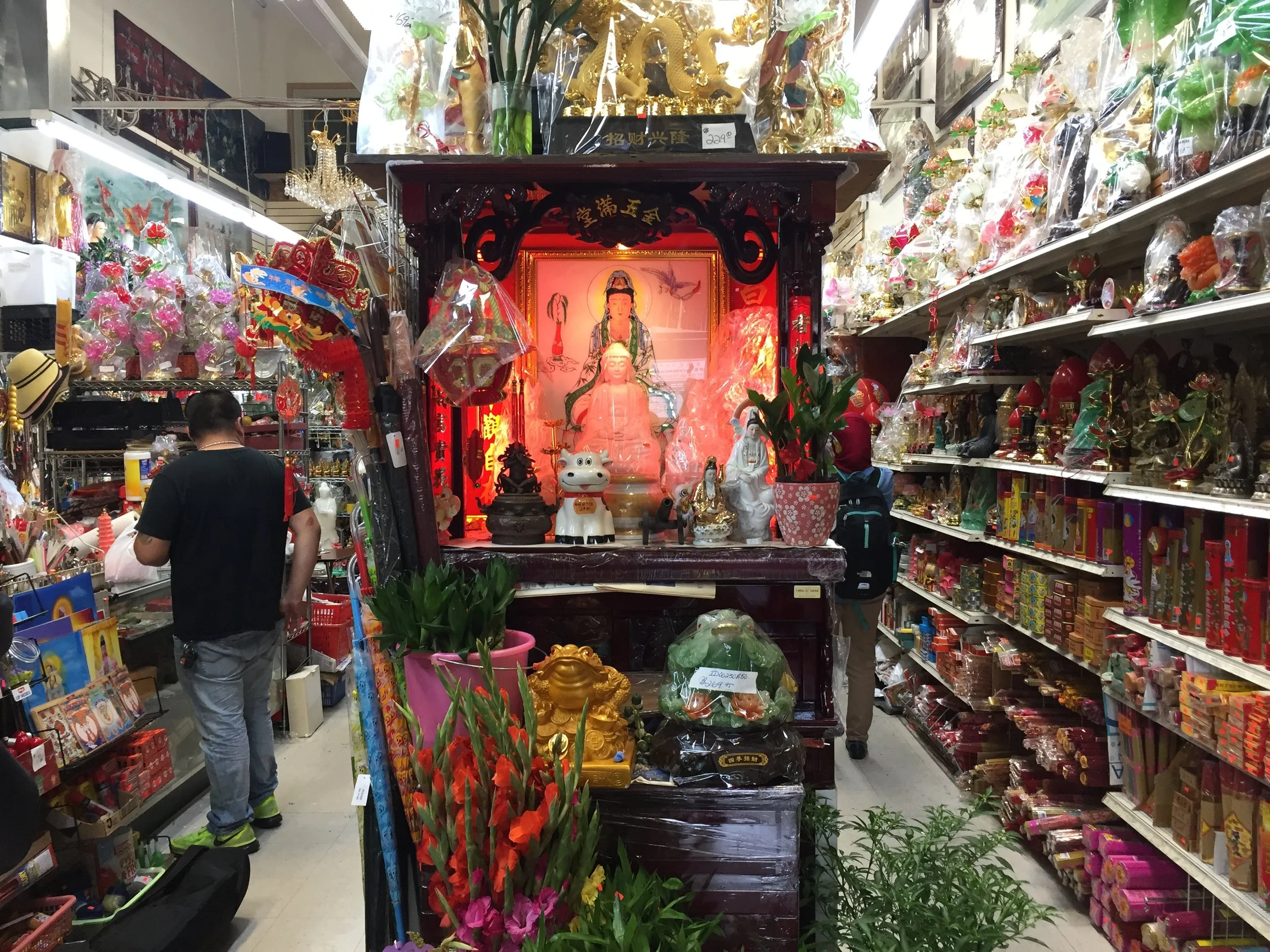 A customer makes a purchase at Wing Kee China Importer Inc. (Photo by Nisa Khan)