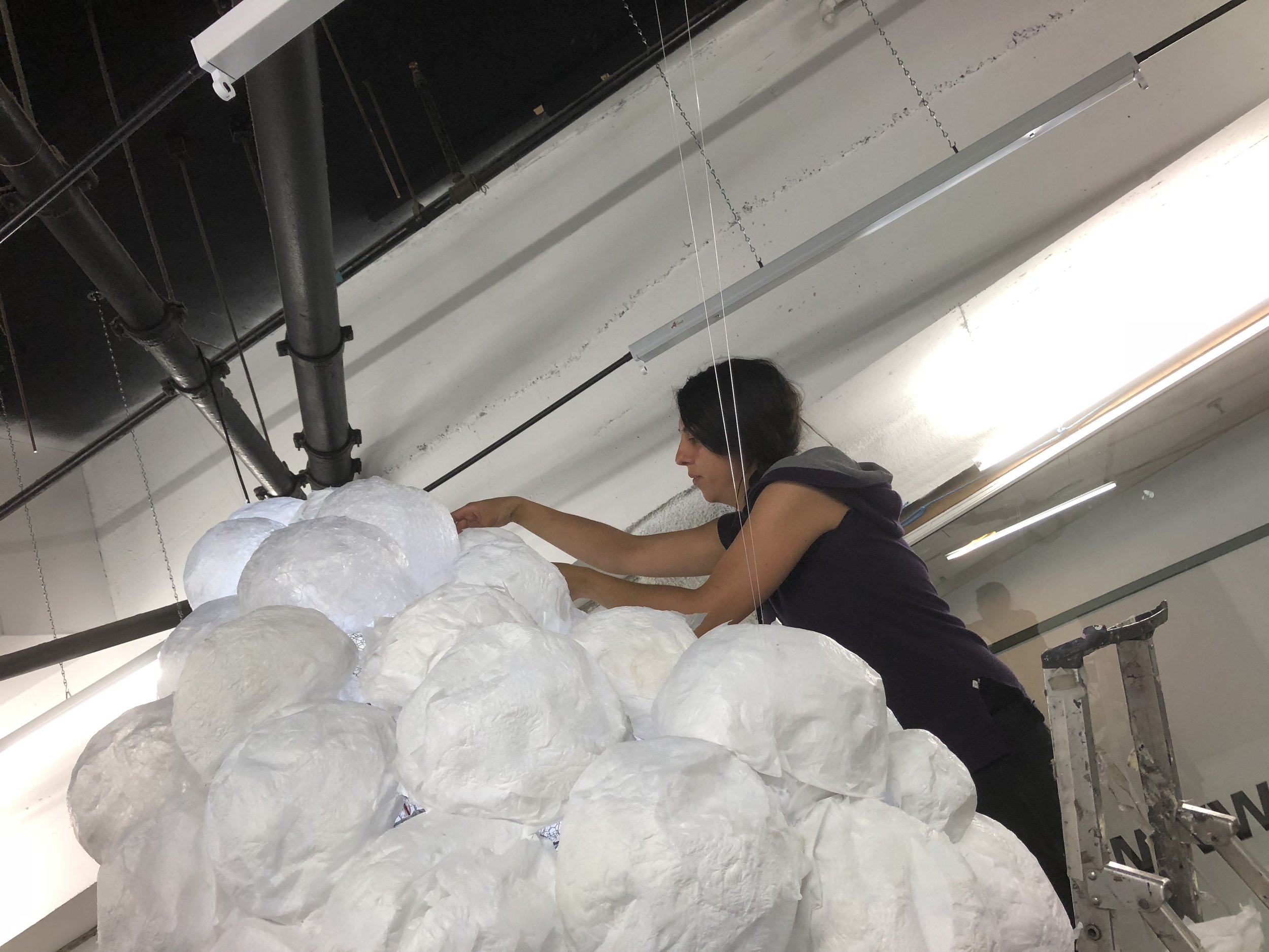  TOMA artist   Gloria Sulli   installing their solo exhibition at the TOMA Project Space. 