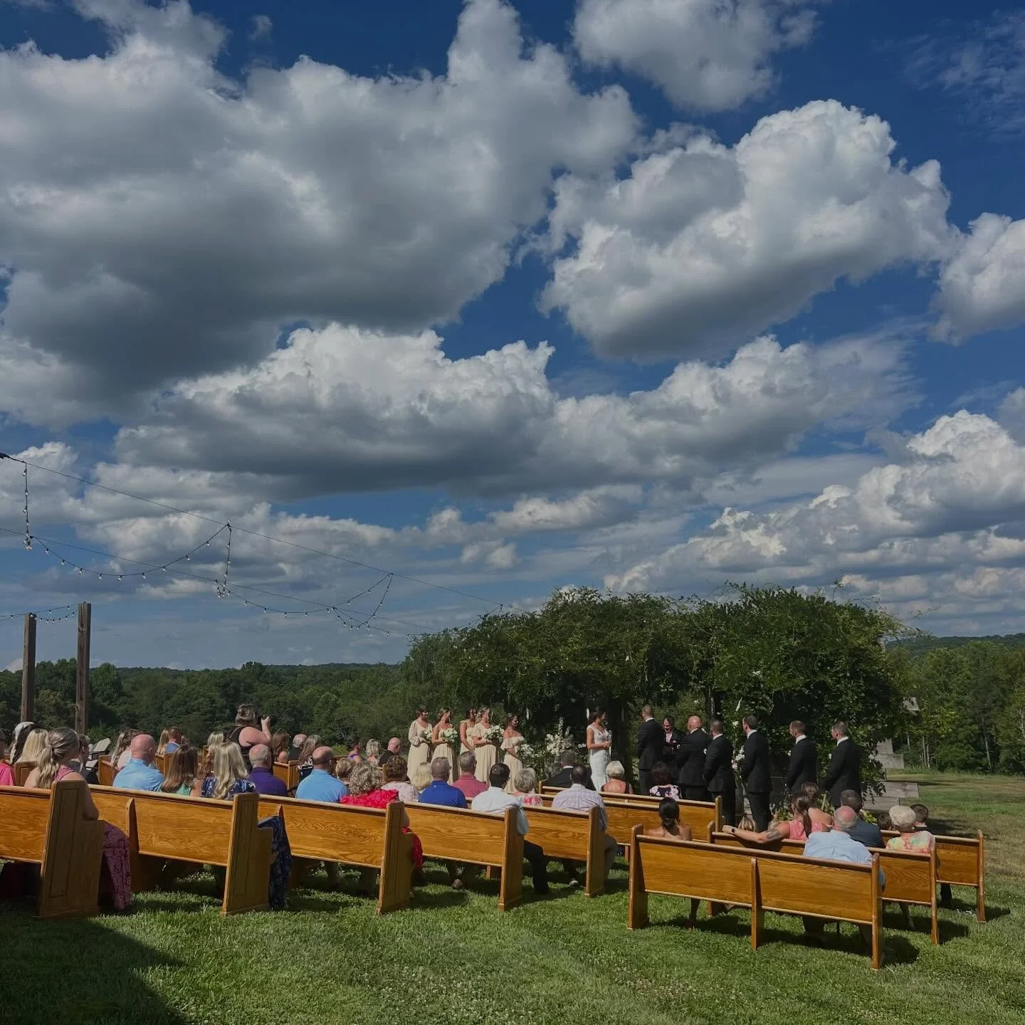 Today&rsquo;s weather has been a little crazy here in foothills of NC Mountains with lots of wild winds and heavy rain. Posting an image from Alex + Landon beautiful sunny Summer wedding day here @amitycreekfarms . They chose our wisteria wall ceremo