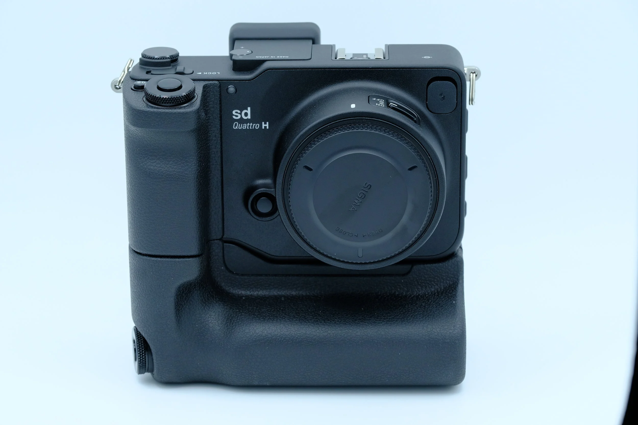 Sigma Sd Quattro H with Pg-41 power grip by Sigma.
