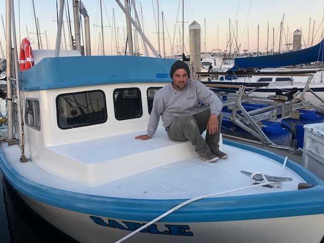 Skylar Campbell and his fishing vessel (F/V) Sable.