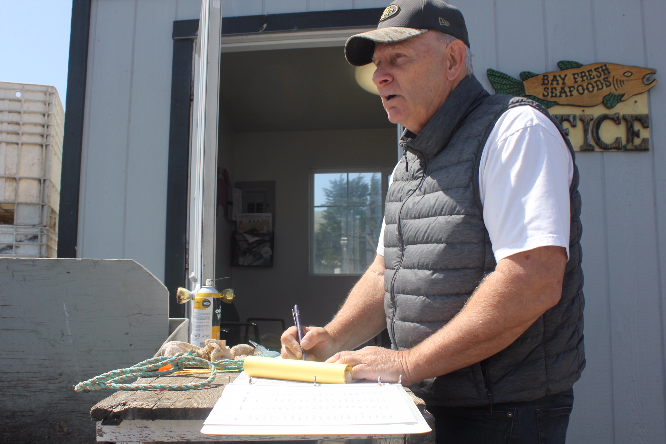 Roger Whitney landing catch at his Bay Fresh Seafood’s office. Photo credit: Ian Cole.