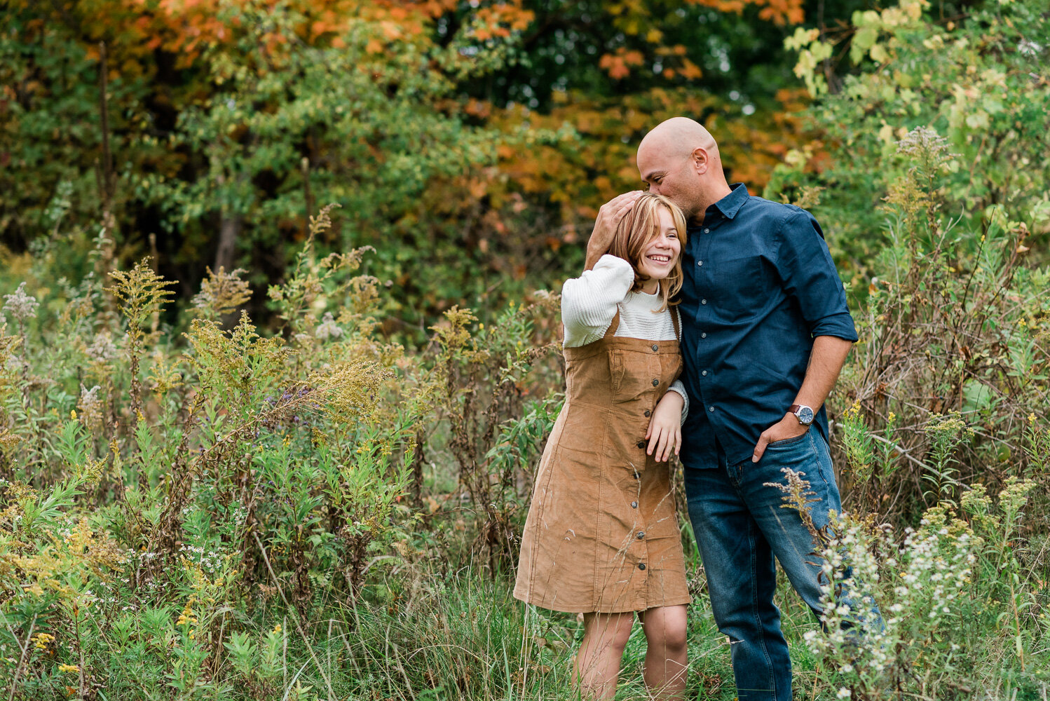 father-daughter-standing-fall-leaves-ceciliasmithphotography-fortdrumphotographer.jpg