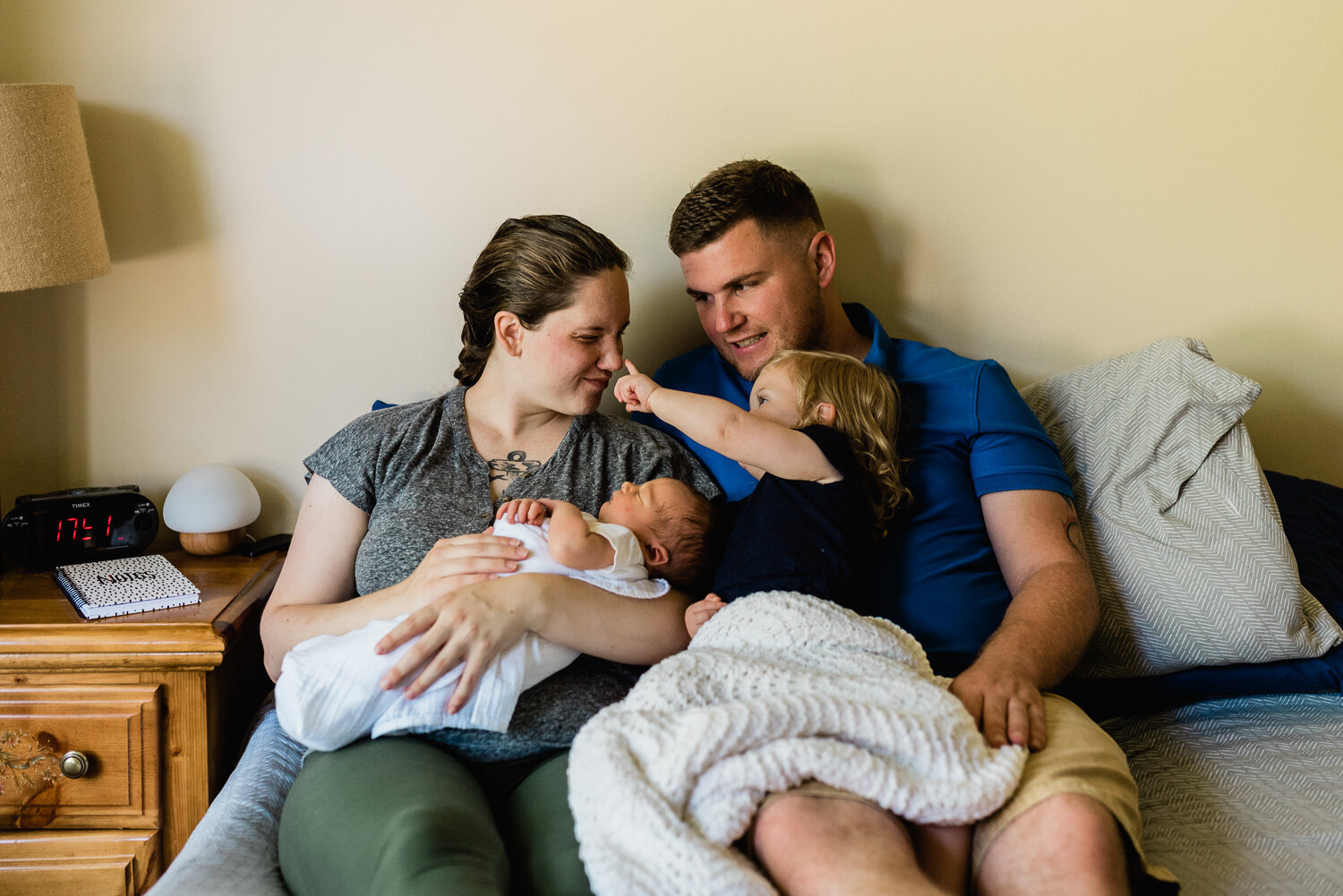 lifestyle newborn photographer in Fort Drum, NY - family of 4 being cozy.jpg