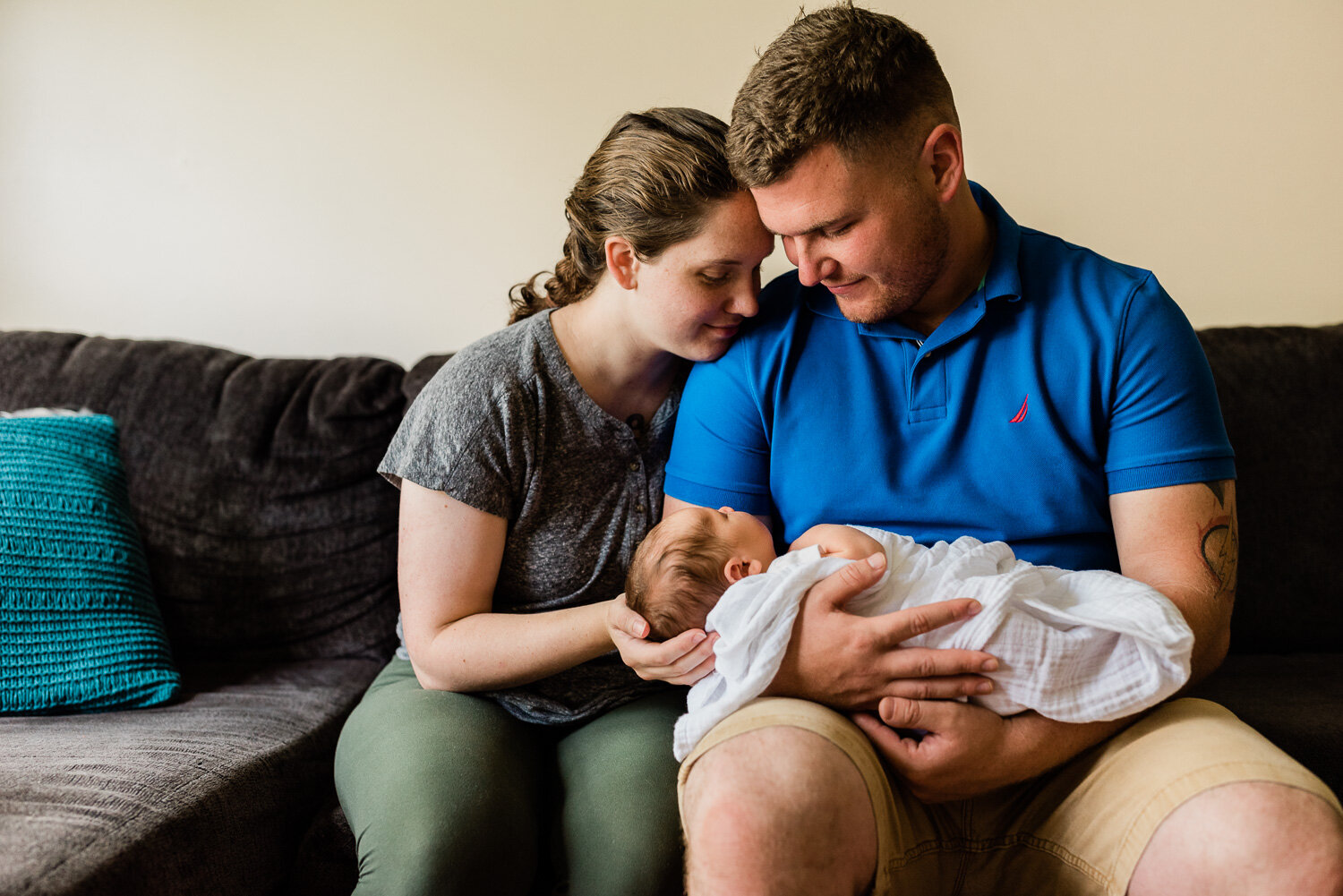 lifestyle newborn photographer in Fort Drum, NY - baby being held by mom and dad-3.jpg