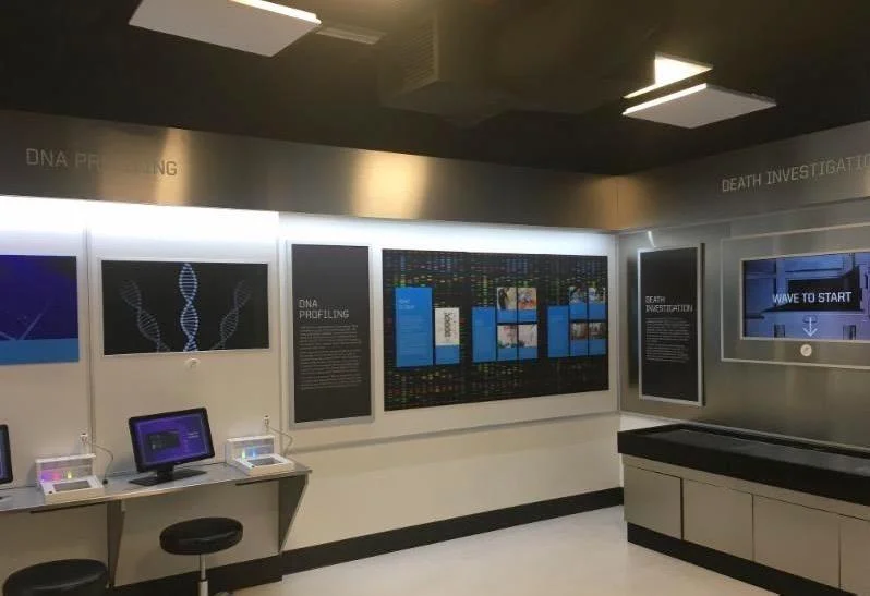 Two ceiling-mounted AS-24i speakers provide isolated sound in the Crime Lab Experience exhibit