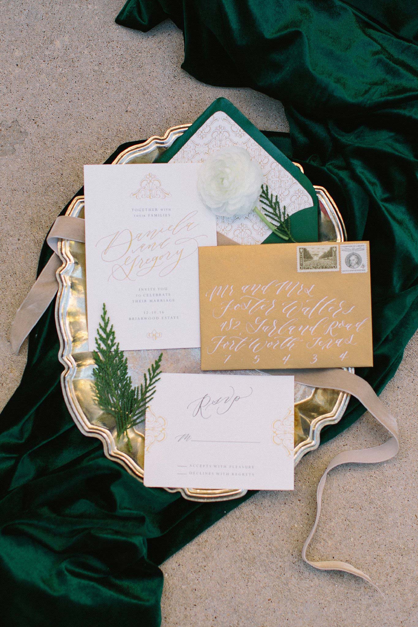 aristide mansfield wedding green and gold invitations on velvet green fabric