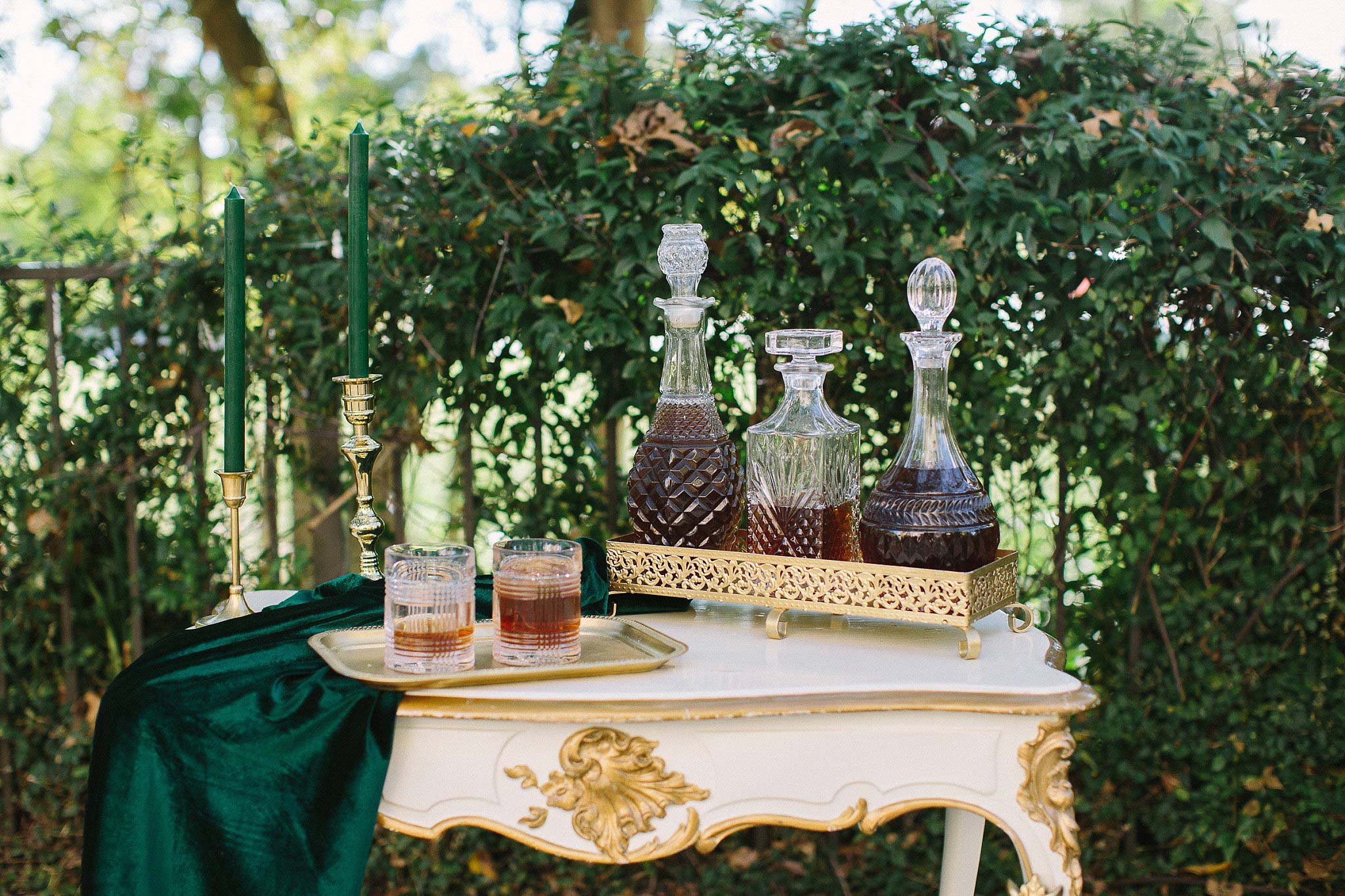 aristide mansfield wedding whiskey bar on white and gold table