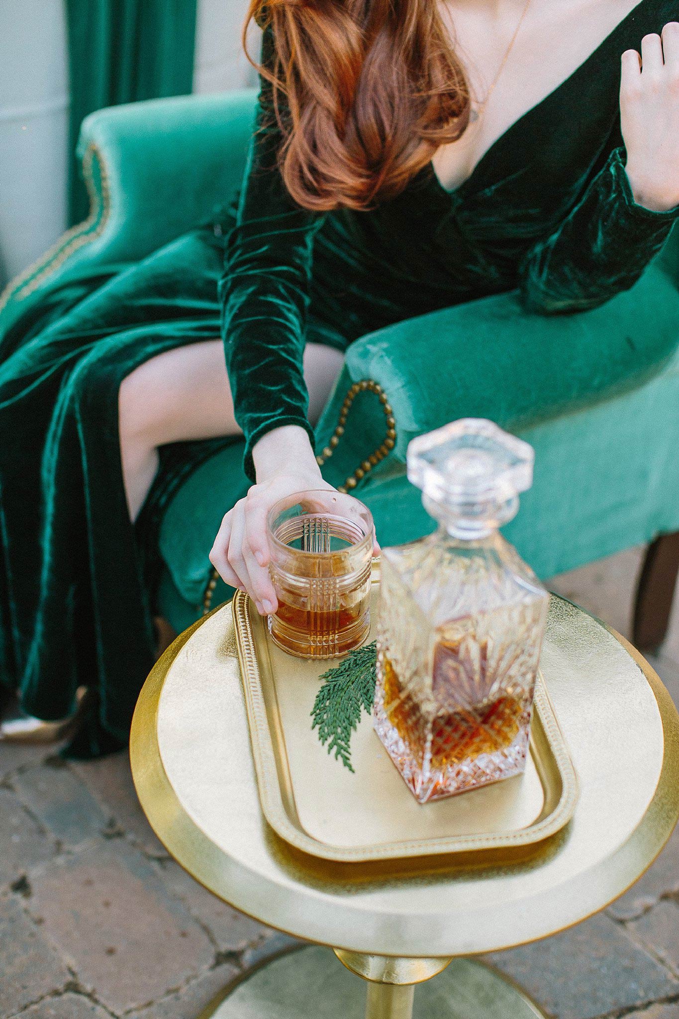 aristide mansfield wedding with green chair and whiskey