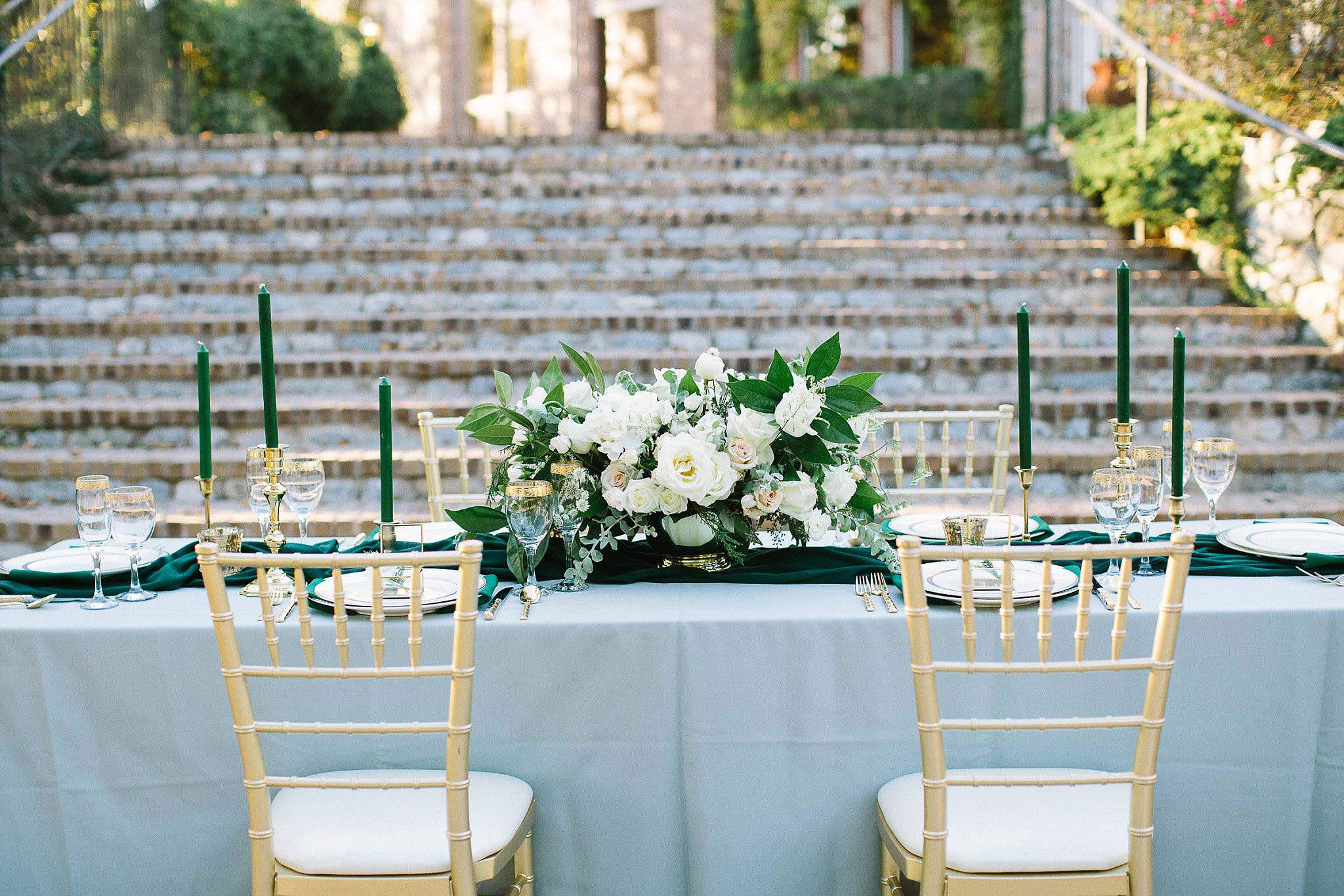aristide mansfield wedding grey reception table with gold chivari chairs