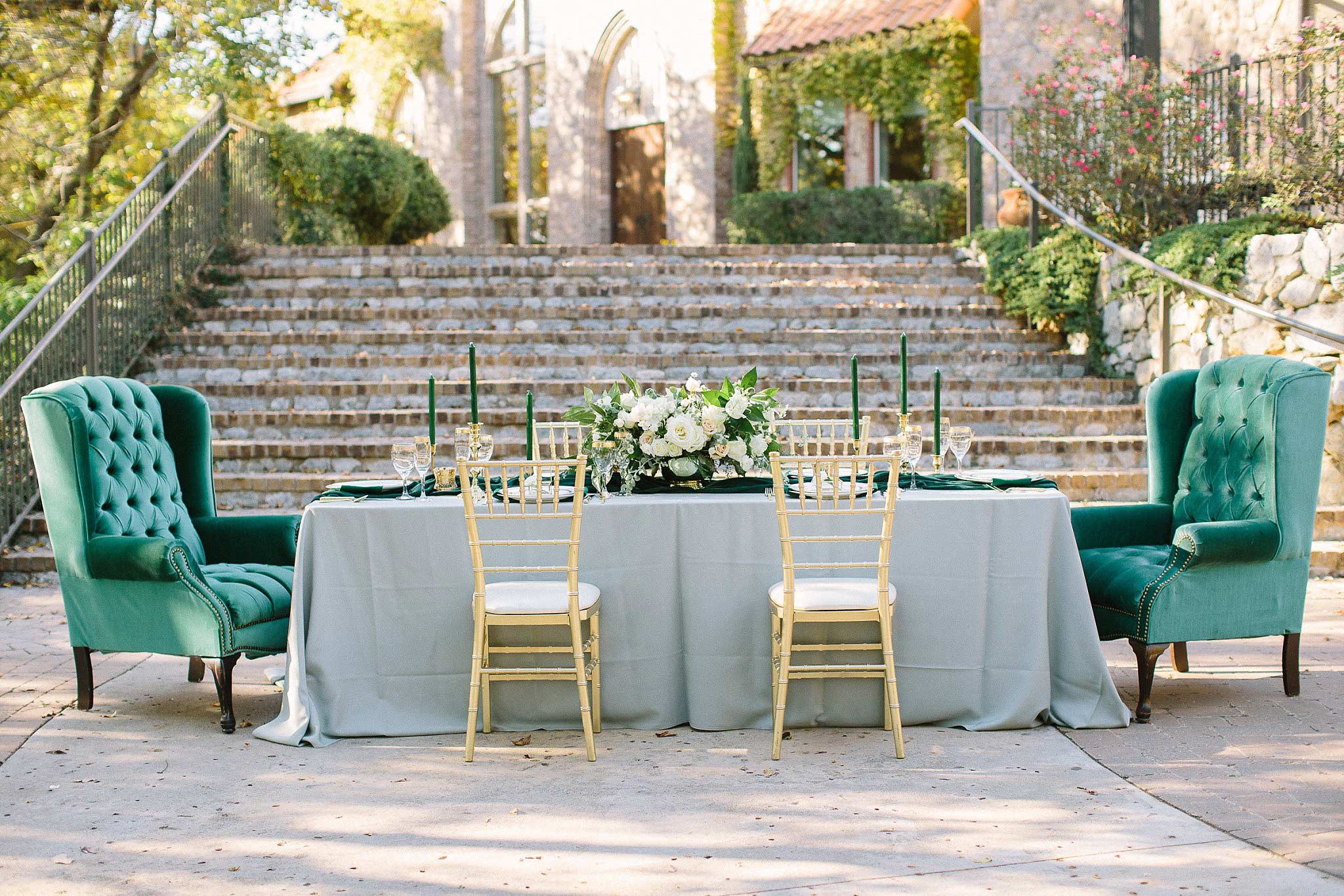 aristide mansfield wedding grey reception table with vintage chairs