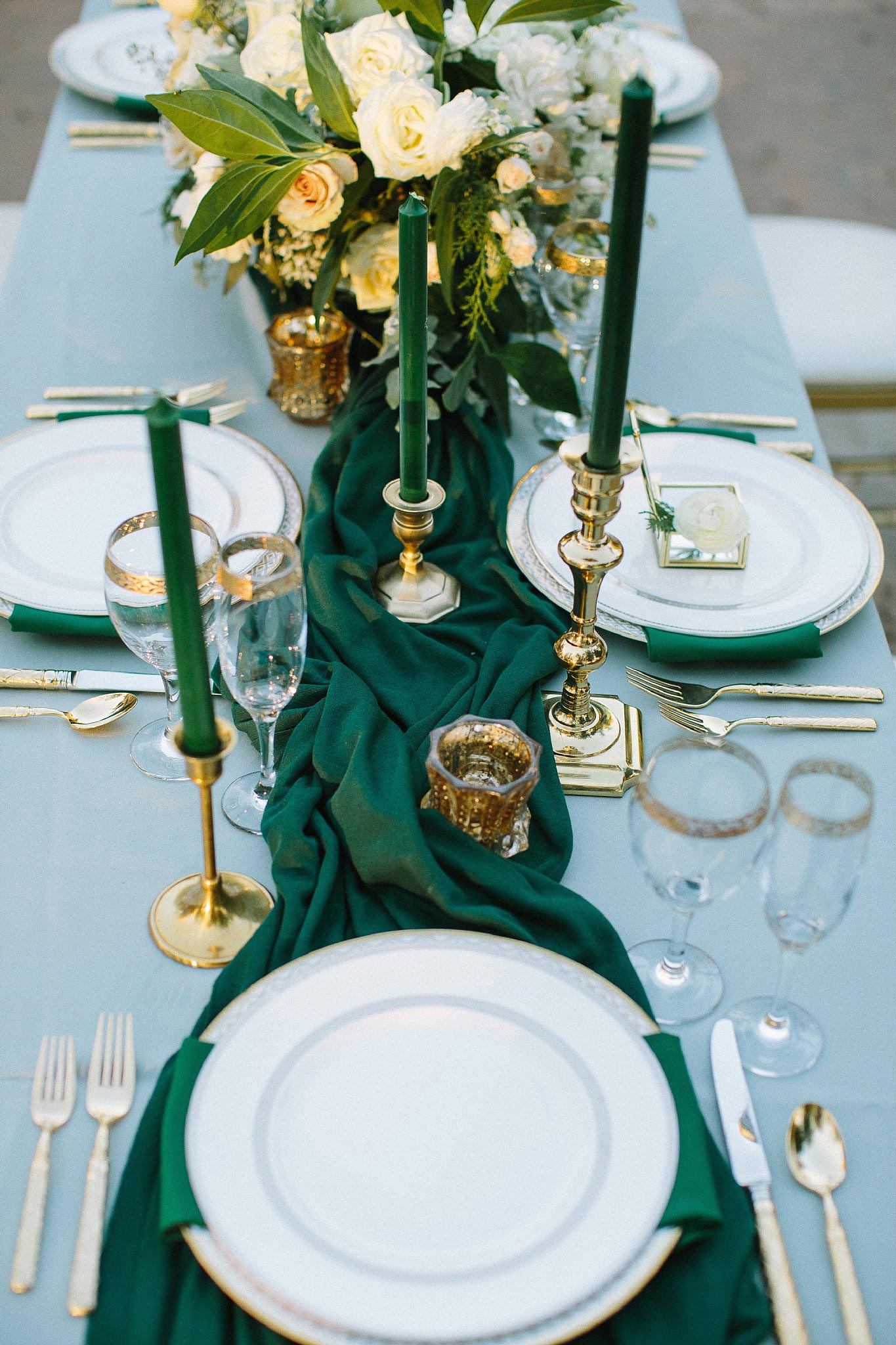 aristide mansfield wedding grey reception table with green runner and gold plates