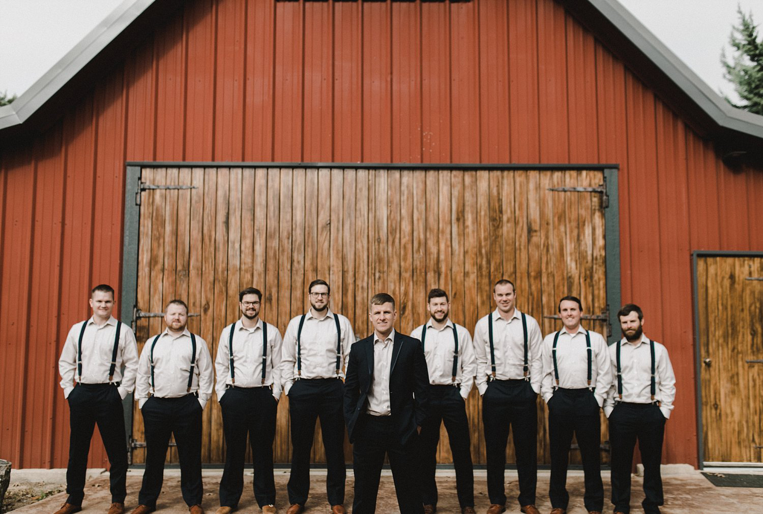 Hollow Hill Farm Event Center Wedding groomsmen with suspenders suites