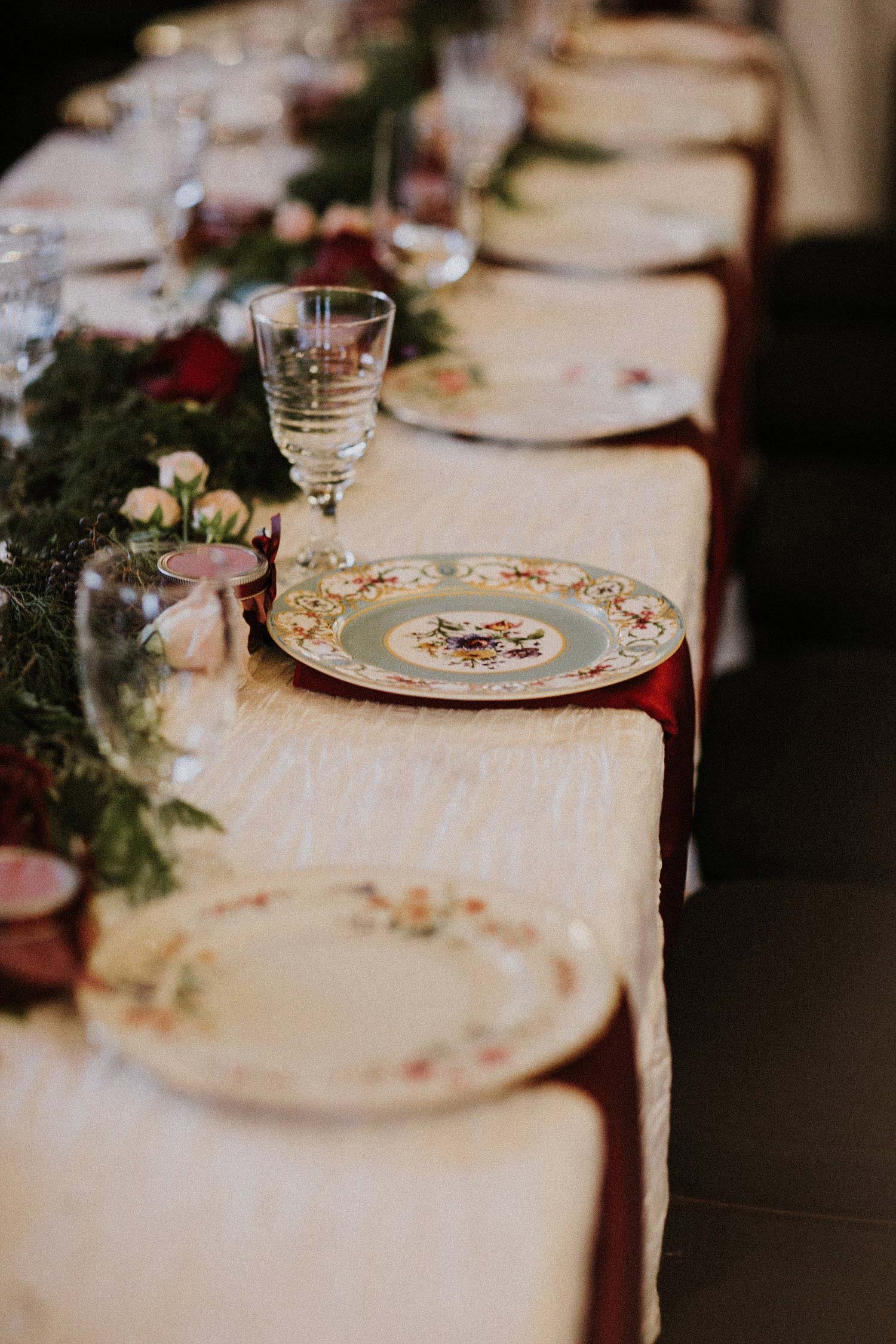 Hollow Hill Farm Event Center Wedding table with vintage china and red napkins