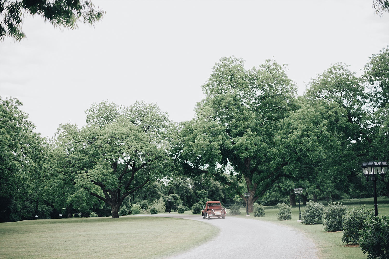 The Orchard Azle wedding vintage truck driving away
