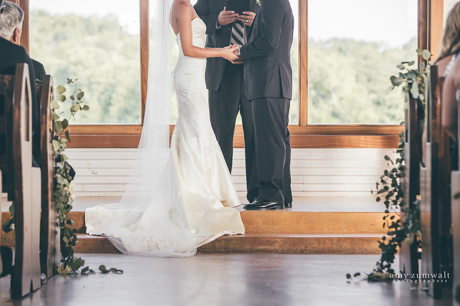 The Brooks at Weatherford wedding ceremony by chapel's windows