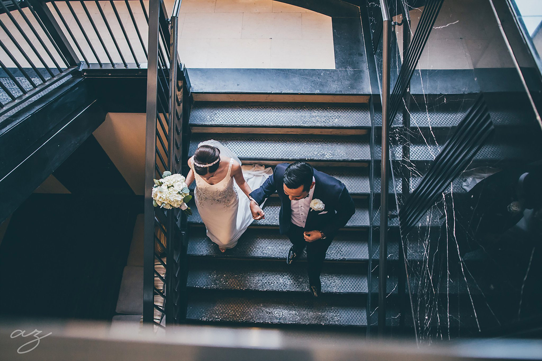 Carlisle Room wedding bride and groom walking down stairs