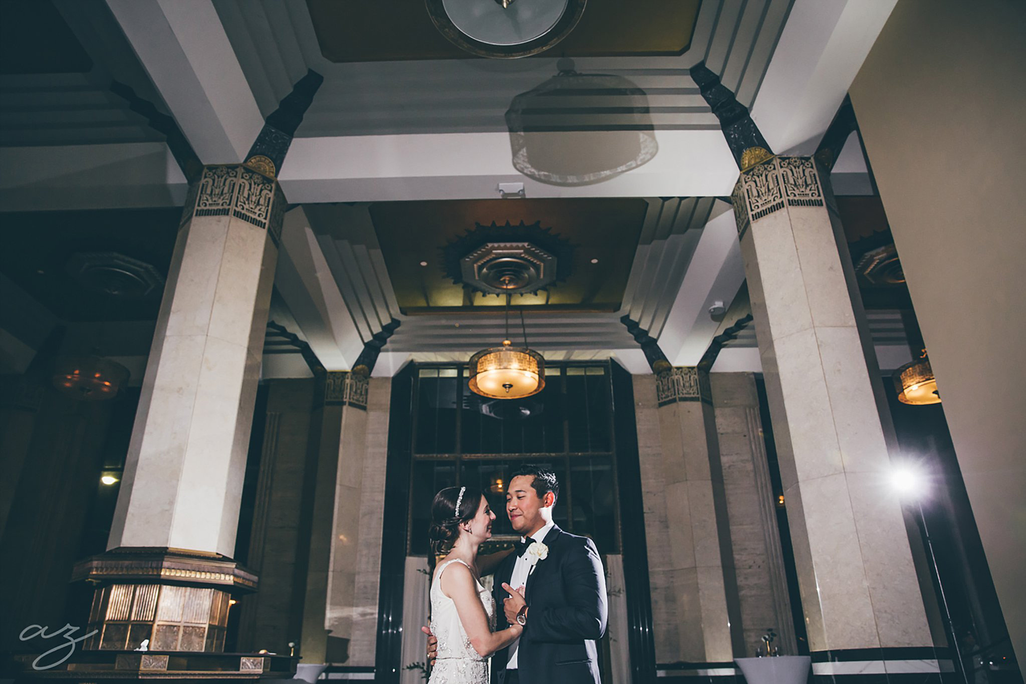 Carlisle Room wedding bride and groom dancing with tall marble columns and art deco