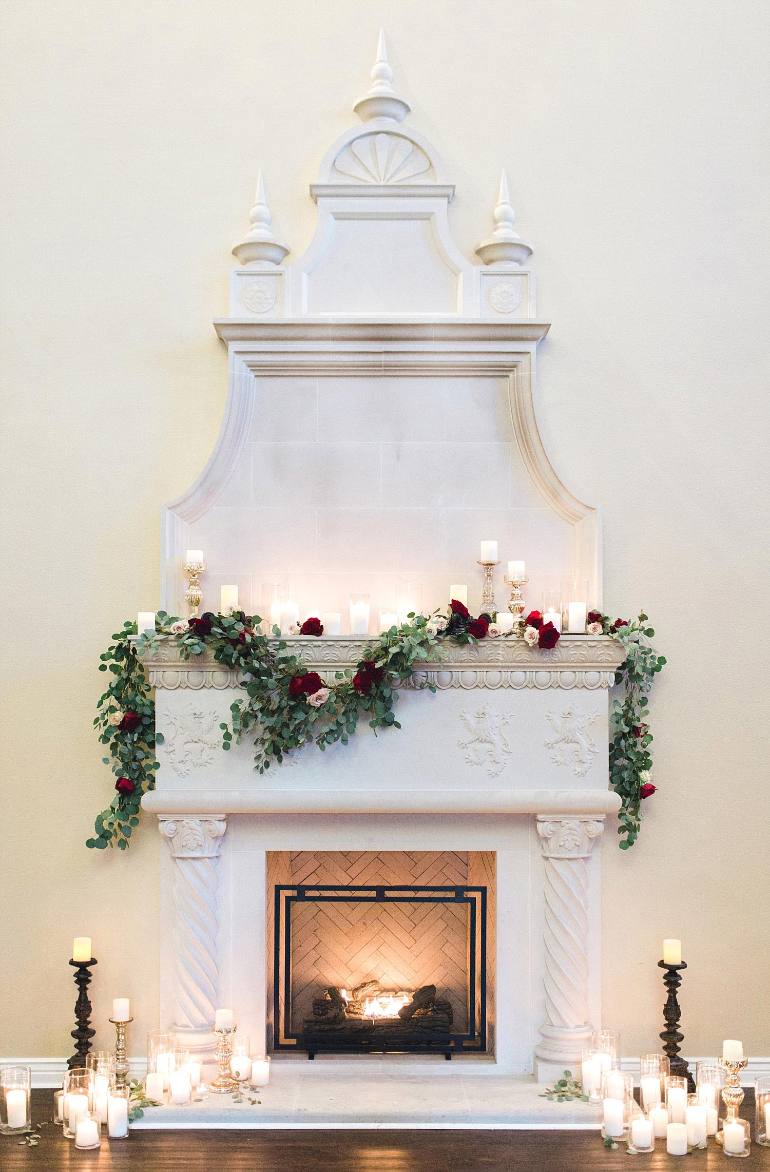 Castle at Rockwall wedding white fireplace with garland and candles photo