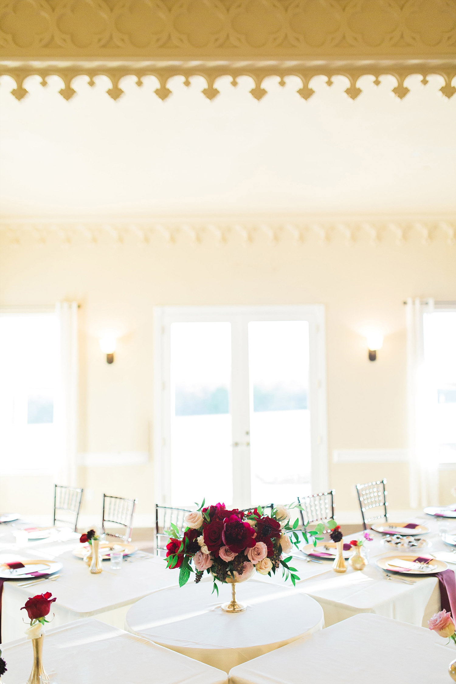Castle at Rockwall wedding banquet room with red flowers