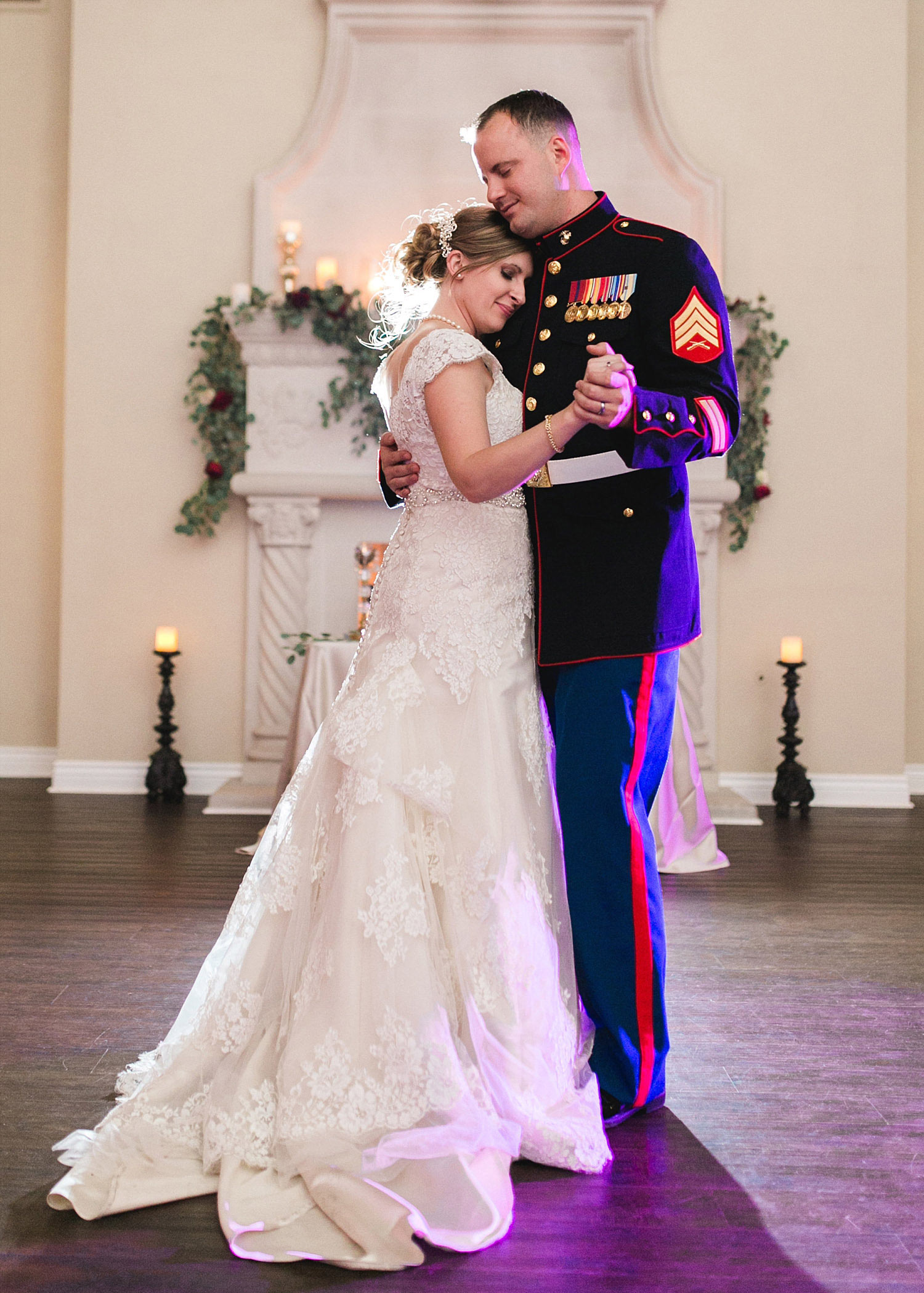 Castle at Rockwall wedding bride and marine groom dancing in front of fireplace