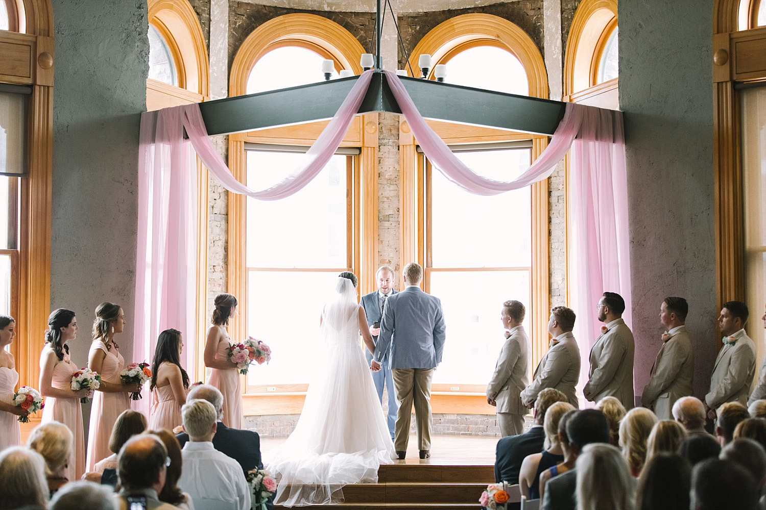 Old Red Museum wedding ceremony with blush fabric at altar