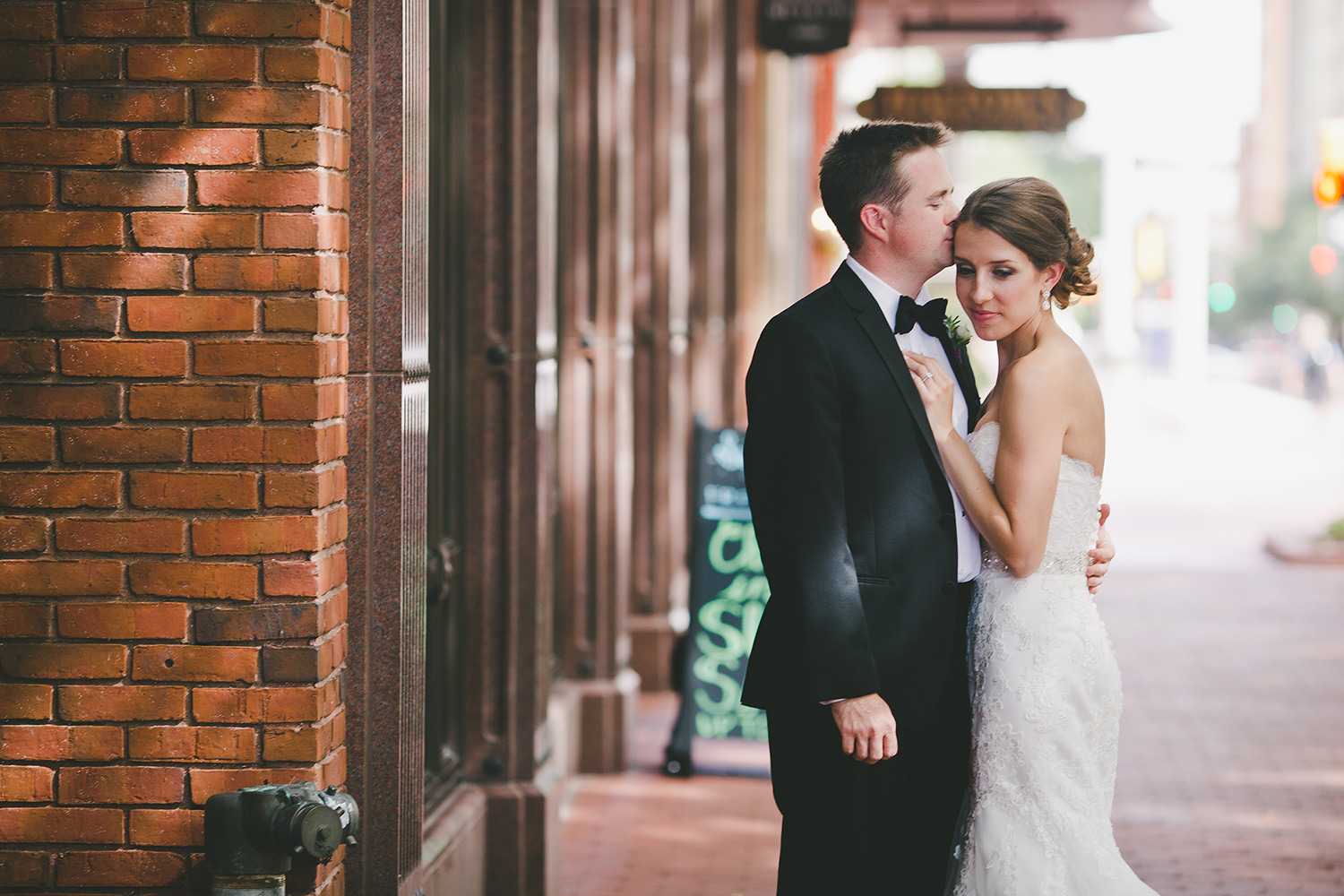 Fort Worth wedding bride and groom kissing in downtown