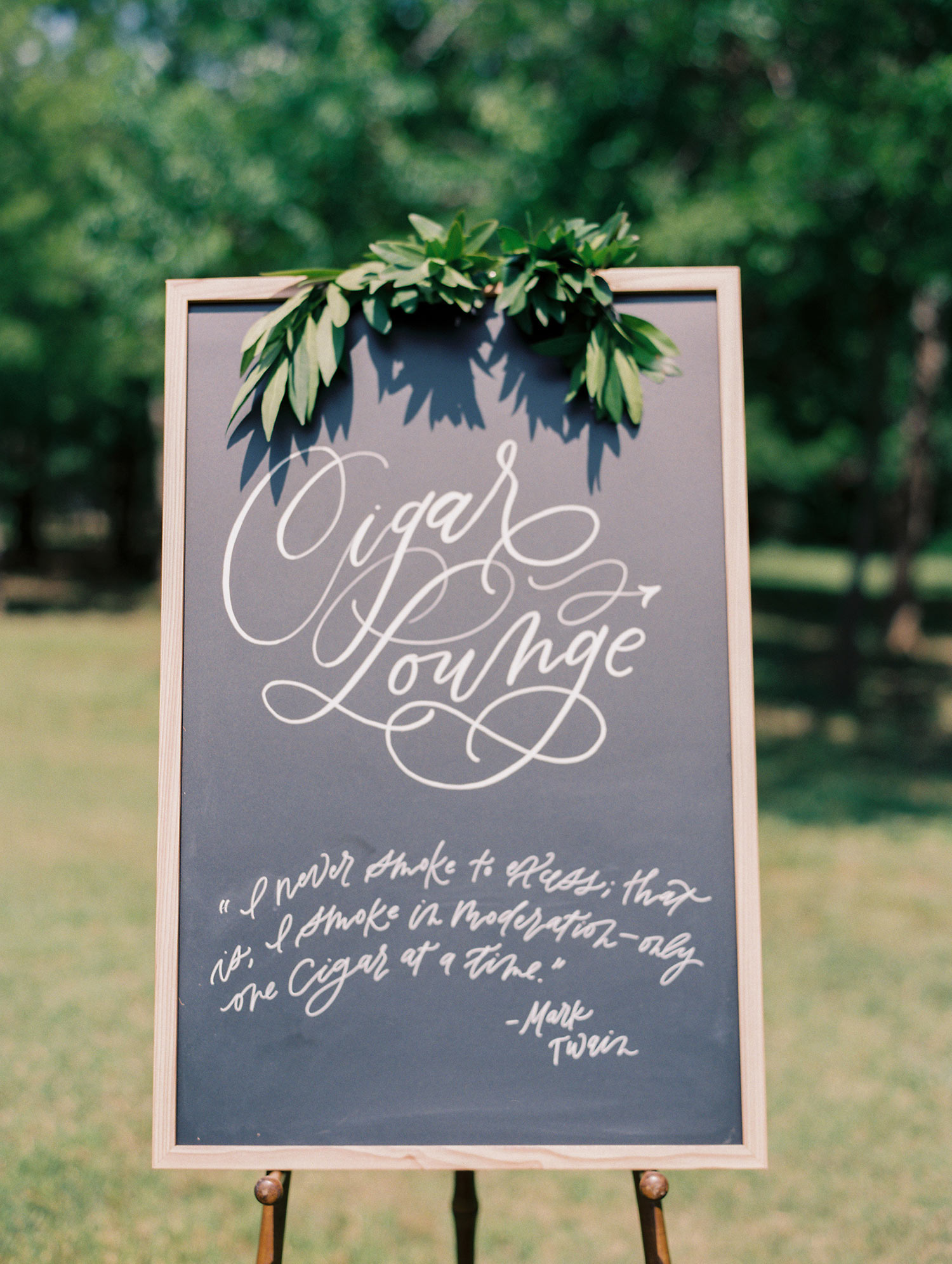 Chalkboard signage with a wood frame for a Cigar Lounge