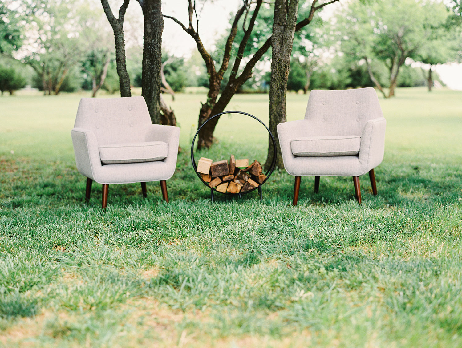 Winter wedding seating lounge with firewood in round hoop