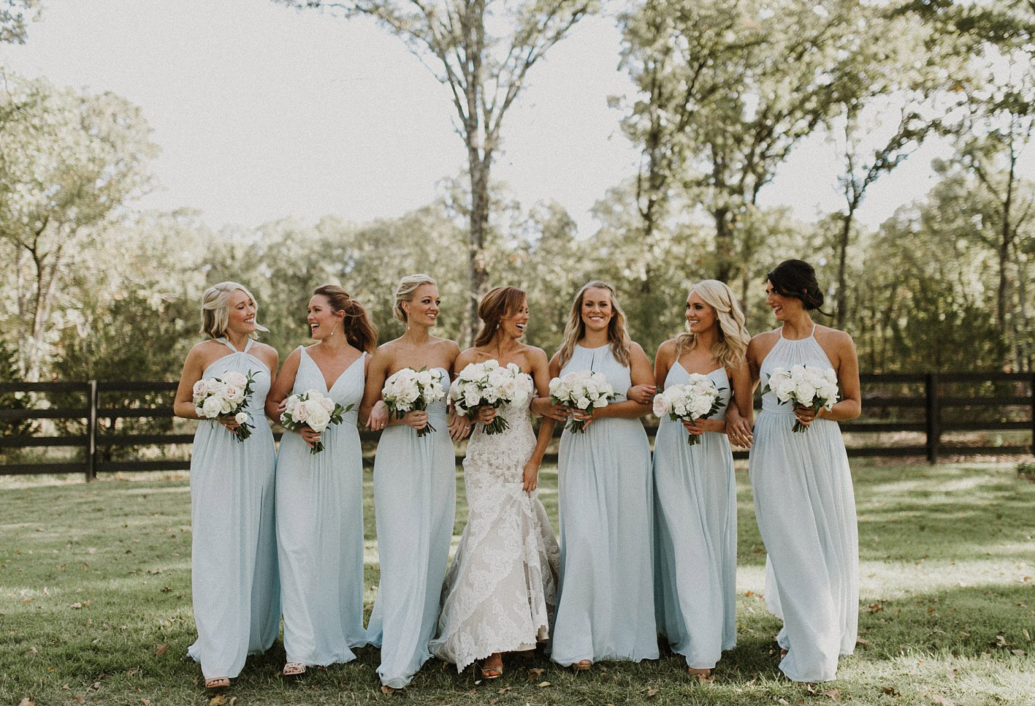 These dusty blue bridesmaid dresses were perfect for this rustic wedding! They matched perfectly with the white and blush bridesmaid bouquets.