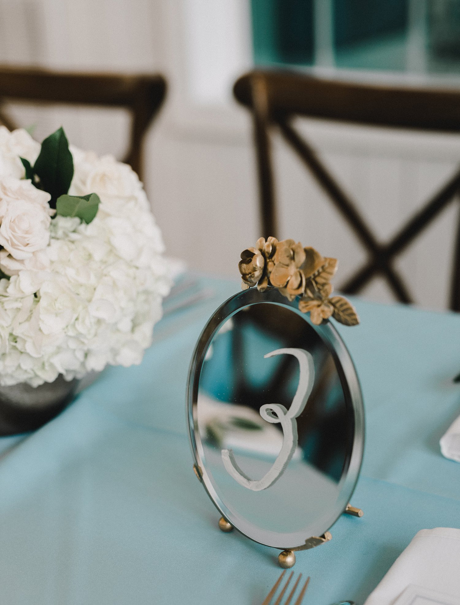 Vintage gold mirror table number for White Sparrow Barn wedding