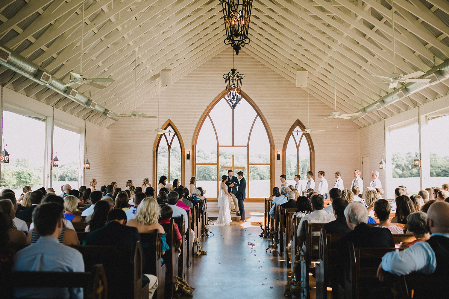 Brooks at Weatherford ceremony in White country chapel with gothic windows