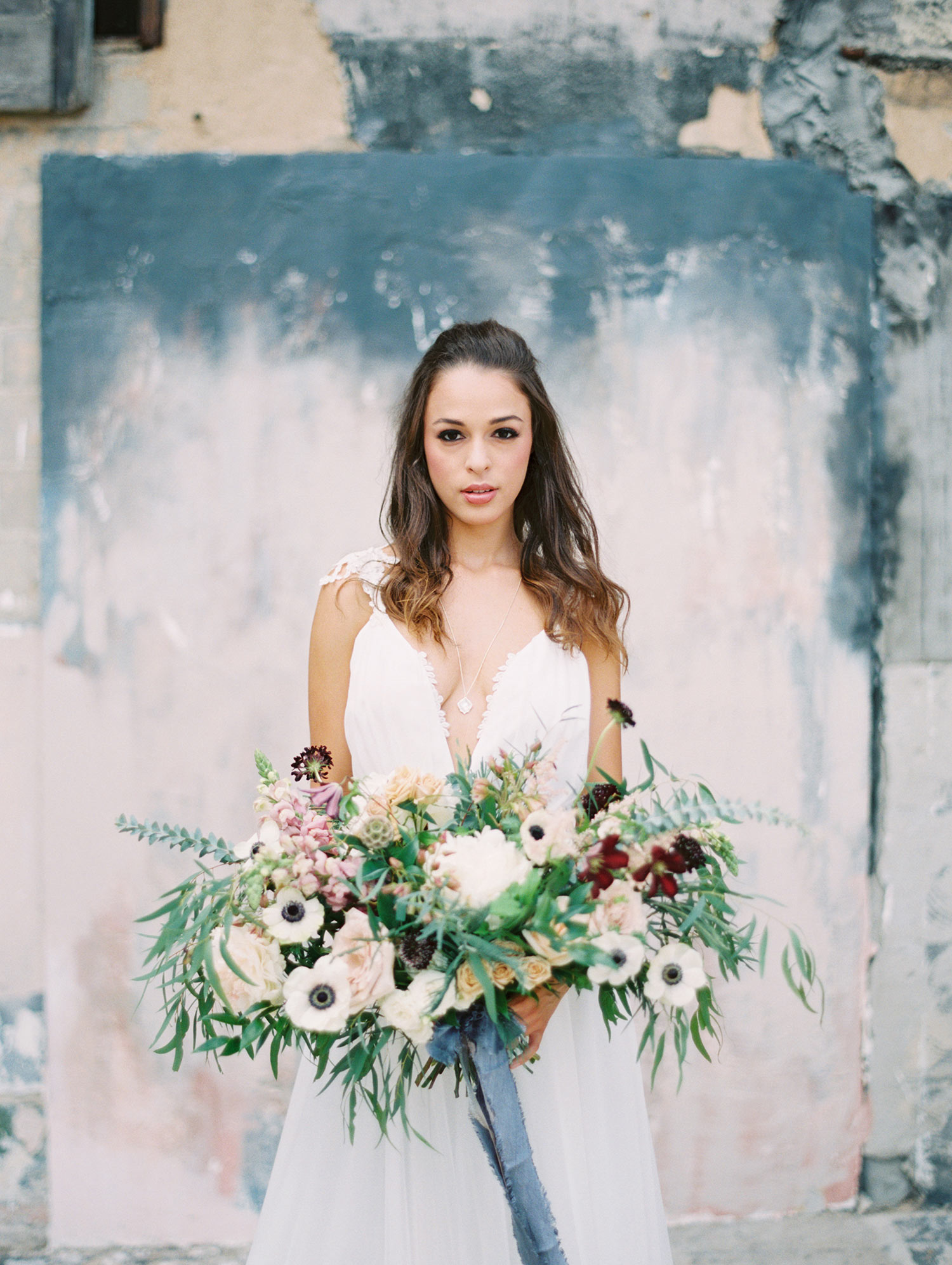 Bride at Post at River East in Fort Worth holding a bouquet