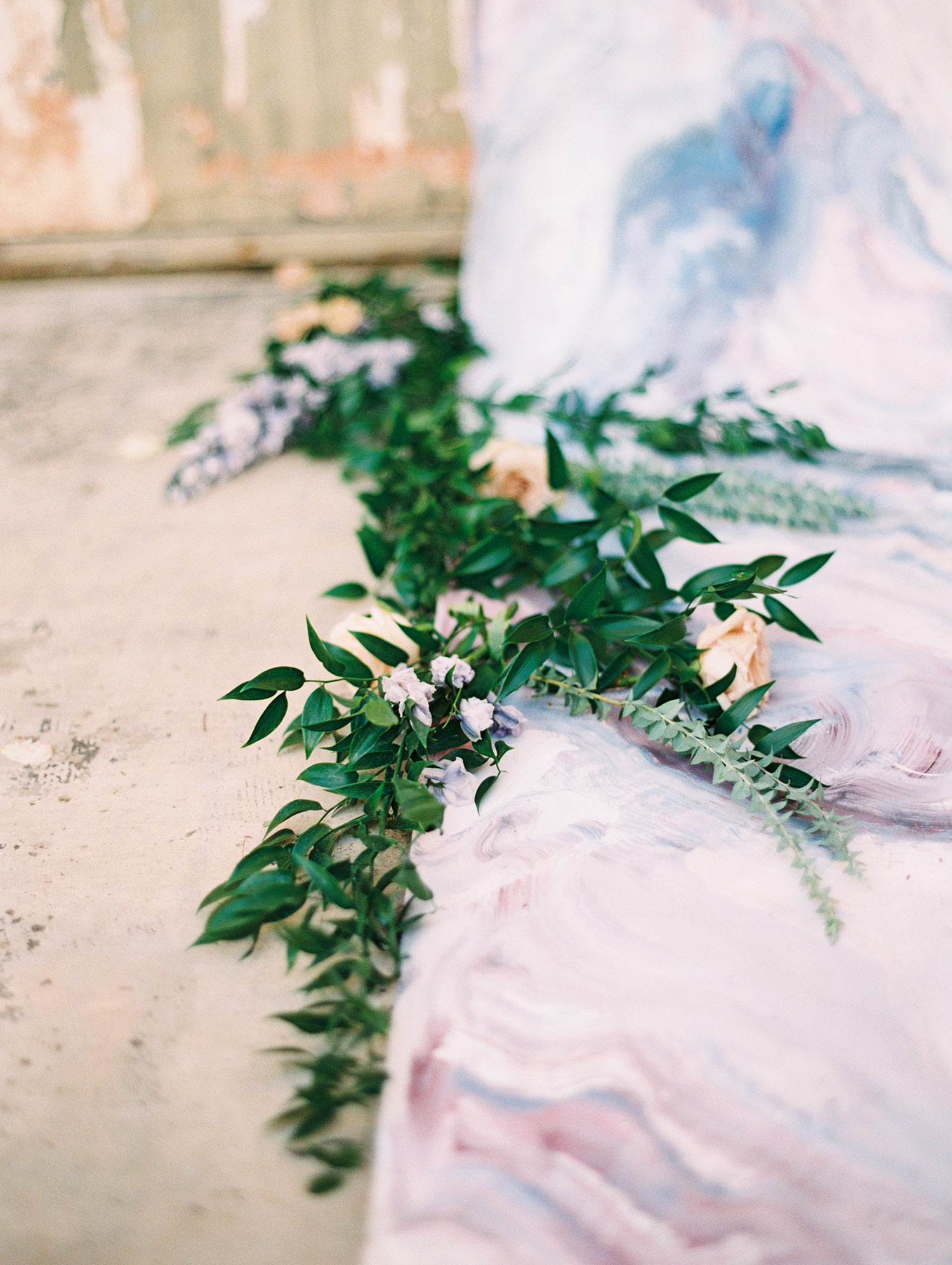 Greenery on wedding aisle with a marble runner