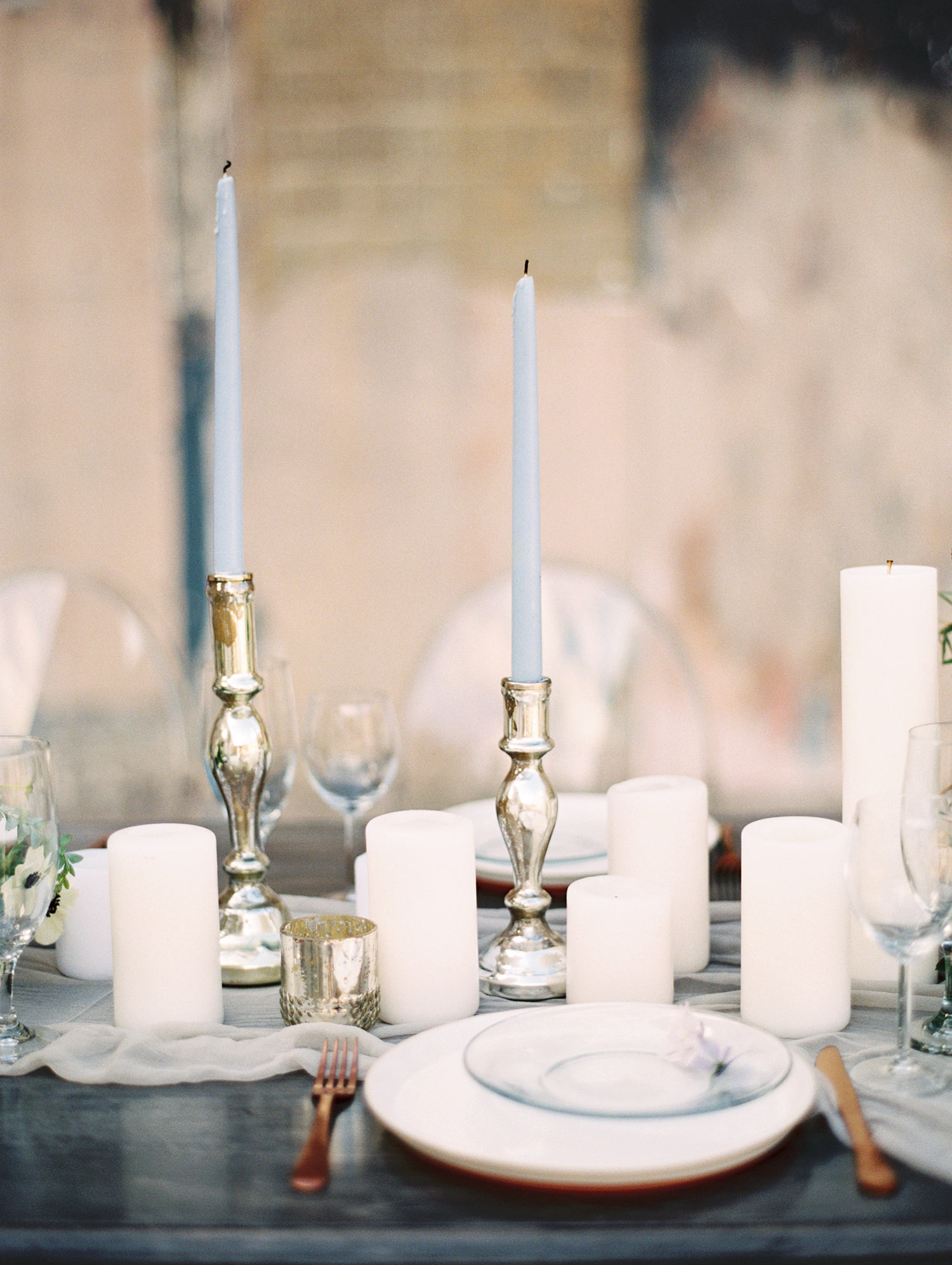 Pilar candles on a romantic white runner
