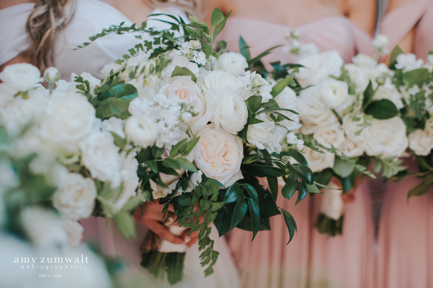 White bouquets with lush greenery