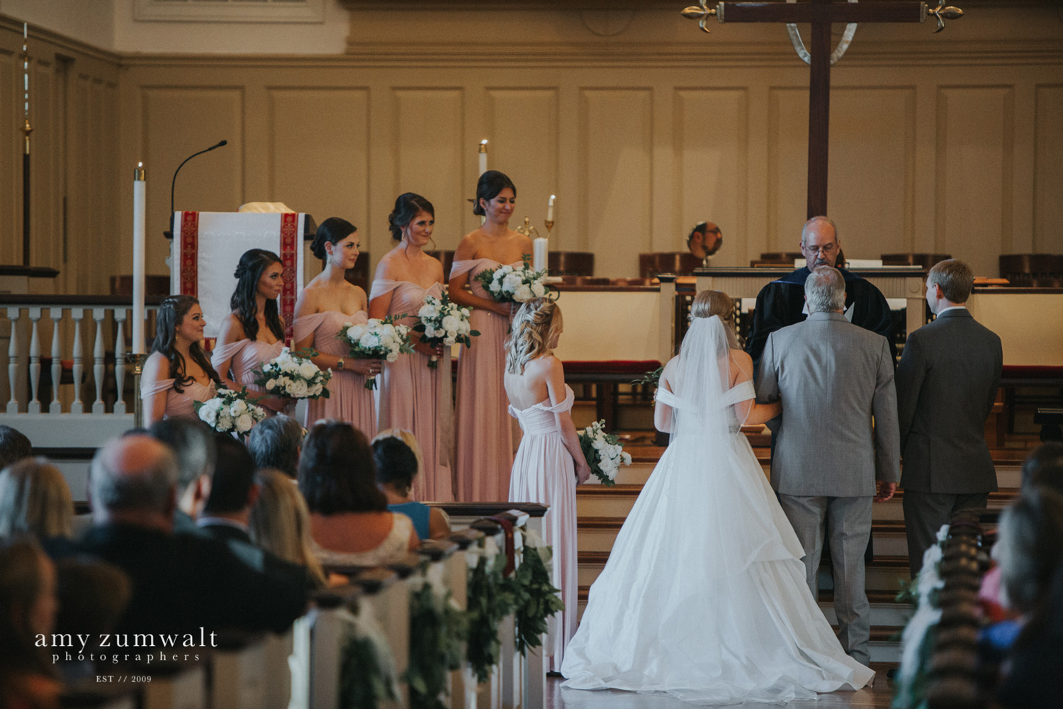 Bridesmaids in mauve bridesmaid dresses at first presbyterian church tyler