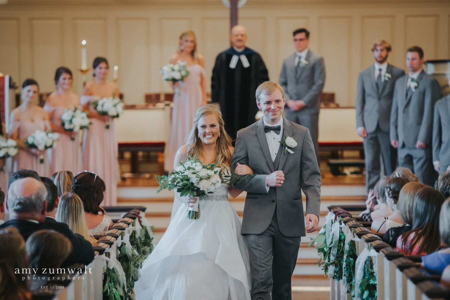 Bride and groom walking down the aisle at first presbyterian church tyler