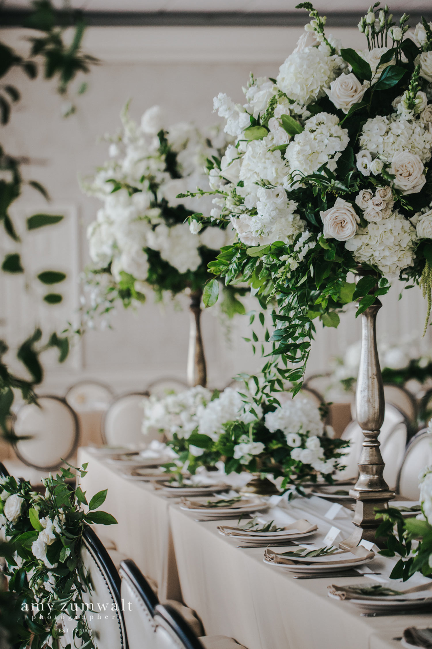 Tall white and green flower arrangements at head table of Willow Brook Country Club in Tyler 