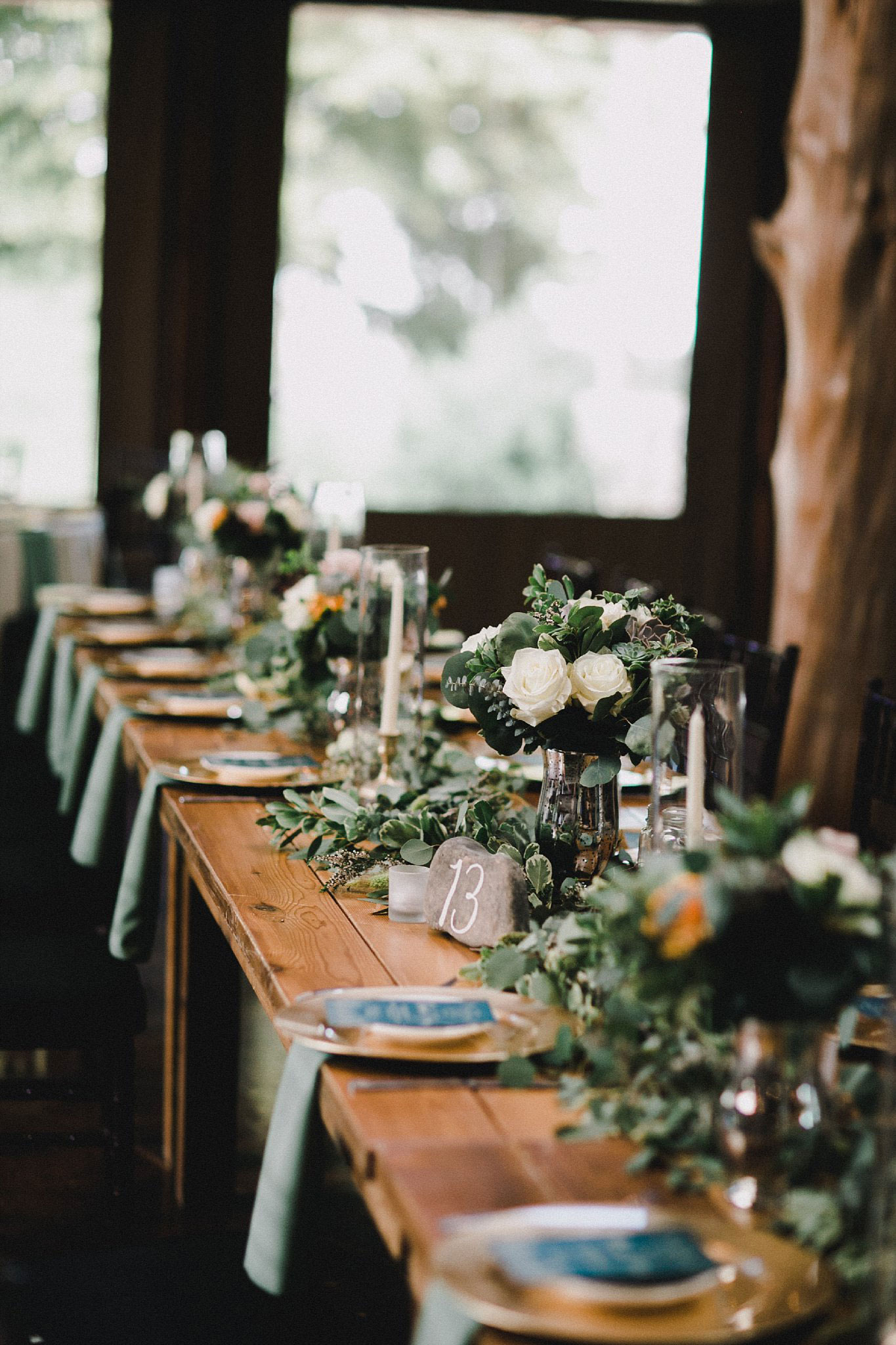 Large greenery garland on wood head table