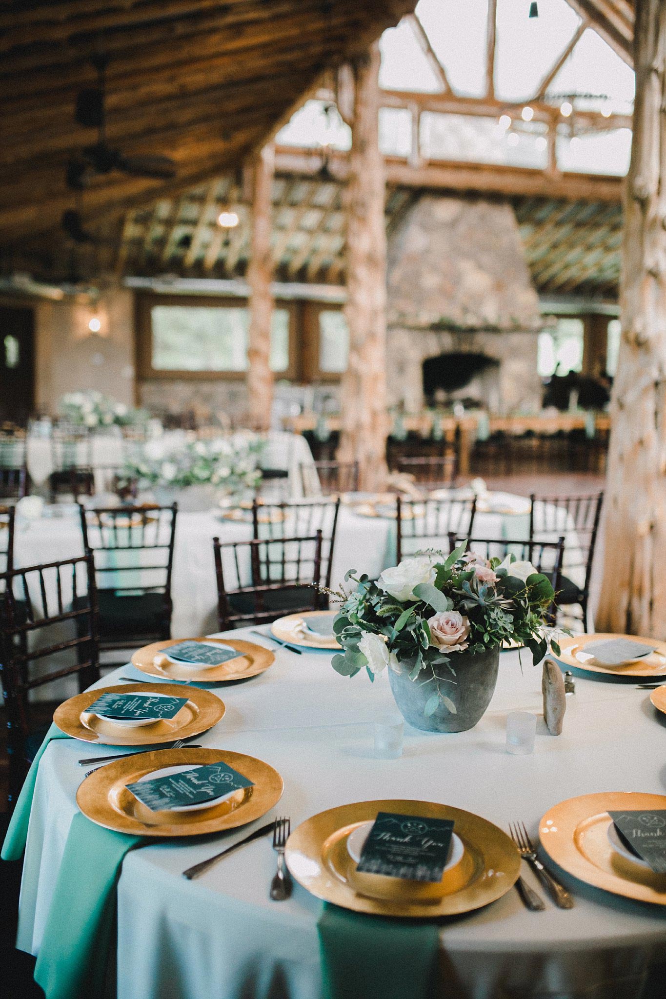Organic wedding at brooks at weatherford wedding reception with ivory tablecloths and sage green napkins