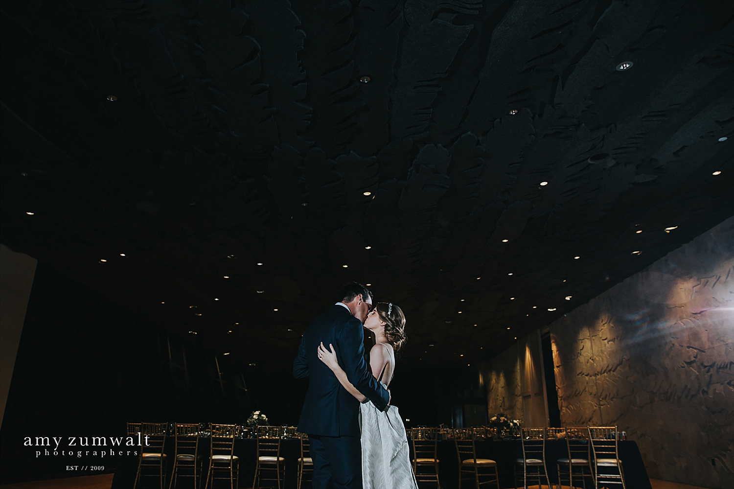 Bride and groom dancing at the Trinity River Audubon Center great room