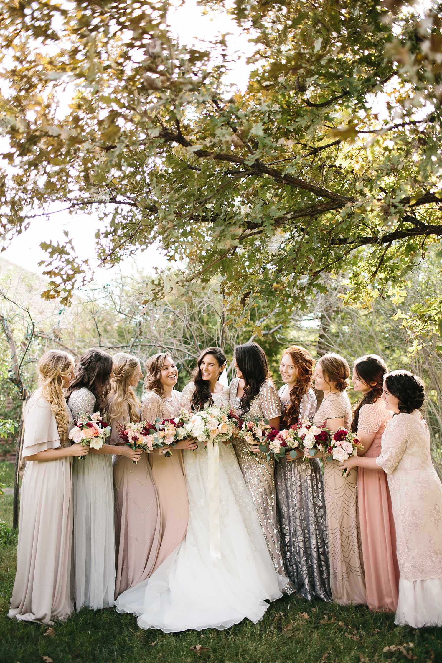Bridesmaids in sequin blush dresses outside
