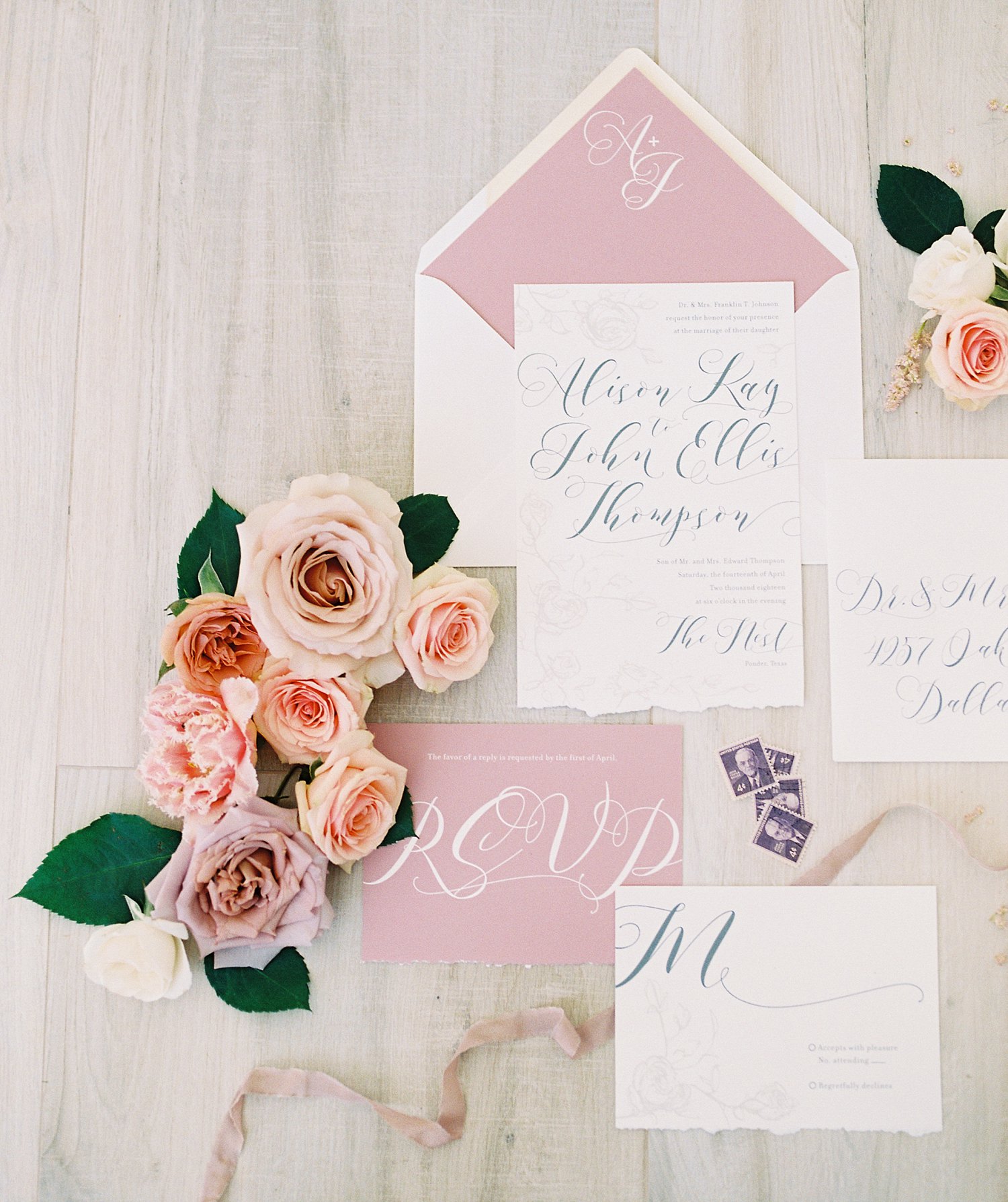 roses styling with wedding invitation