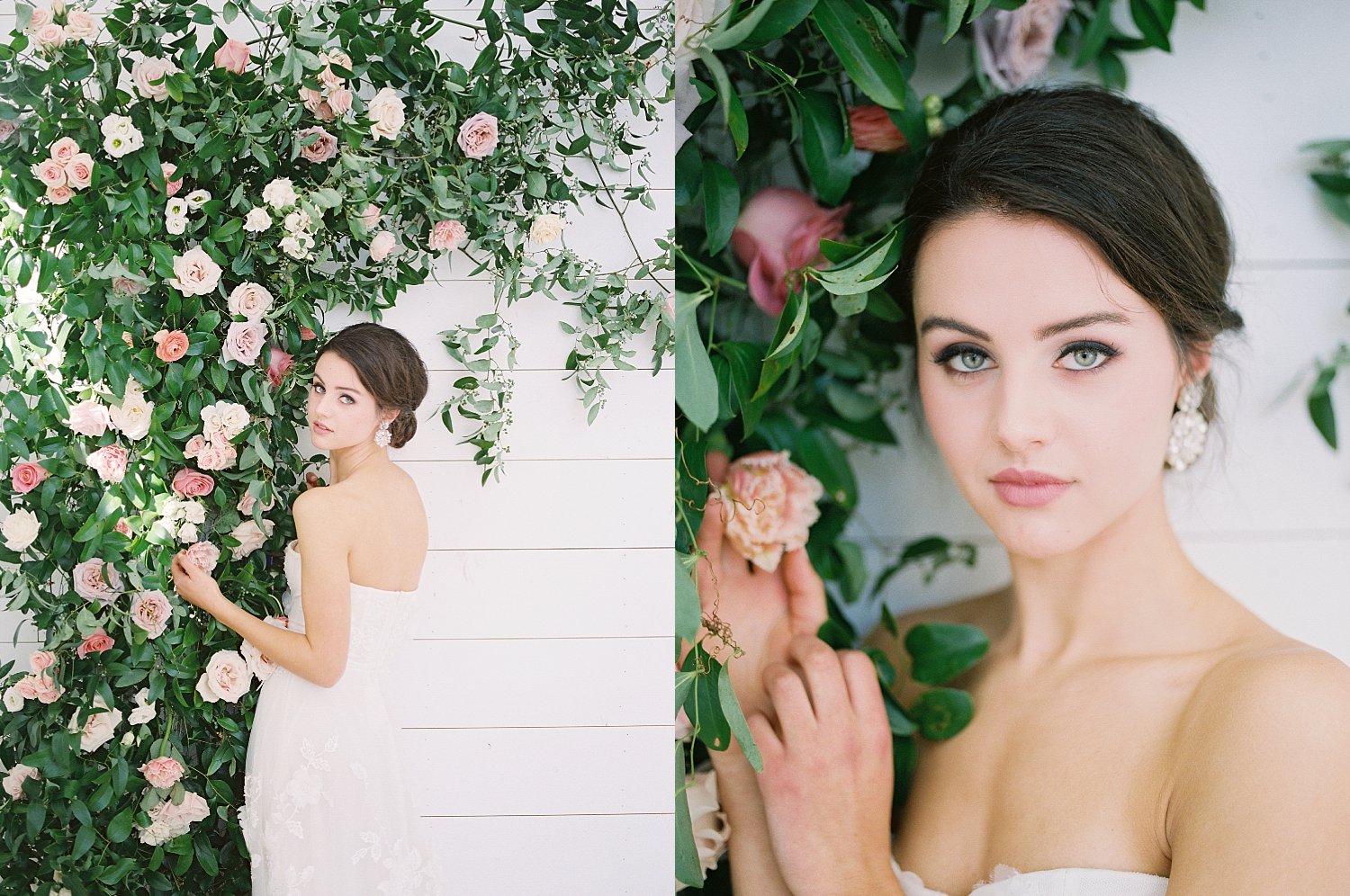 Bride smelling rose against white wall